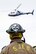 A firefighter from the St. Joseph Fire Department watches a LifeNet Air Medical Services helicopter take off during a major accident response exercise (MARE) at Rosecrans Memorial Airport, St. Joseph, Mo., April 12, 2012. The MARE tested Air National Guard and civilian agencies in their ability to respond to an aircraft accident. (U.S. Air Force photo by Staff Sgt. Michael Crane/Missouri Air National Guard)