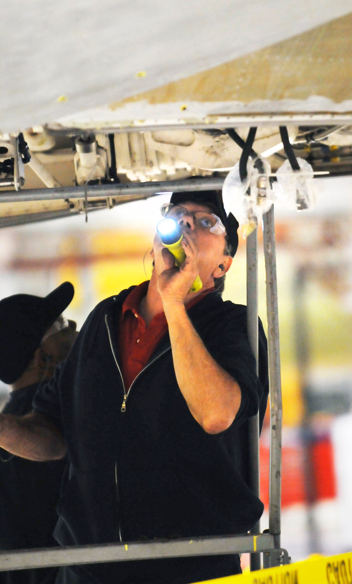 Dwain Nix, hydraulics mechanic, performs an inspection on C-5 landing gear components. (U. S. Air Force photo by Sue Sapp)