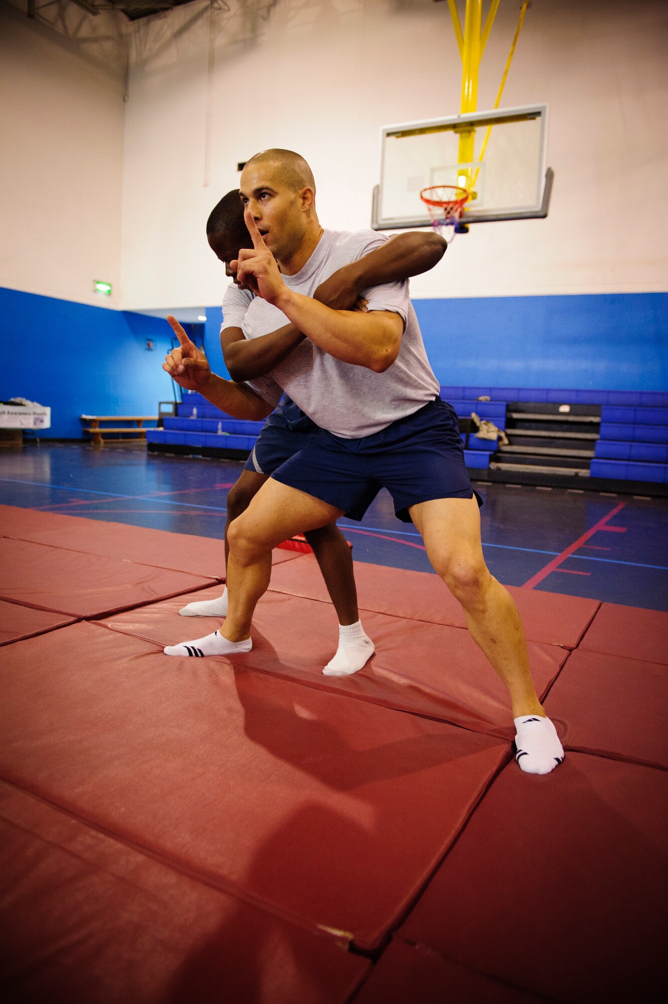 SOUTHWEST ASIA – Tech. Sgt. Ivan Abudo, 379th Expeditionary Communications Squadron, demonstrates how to break free of a perpetrator’s grasp during a self defense class here April 12, 2012. Attendees learned how to counter their attacker’s advances and how to avoid putting themselves in bad situations. (U.S. Air Force photo/Staff Sgt. Nathanael Callon)