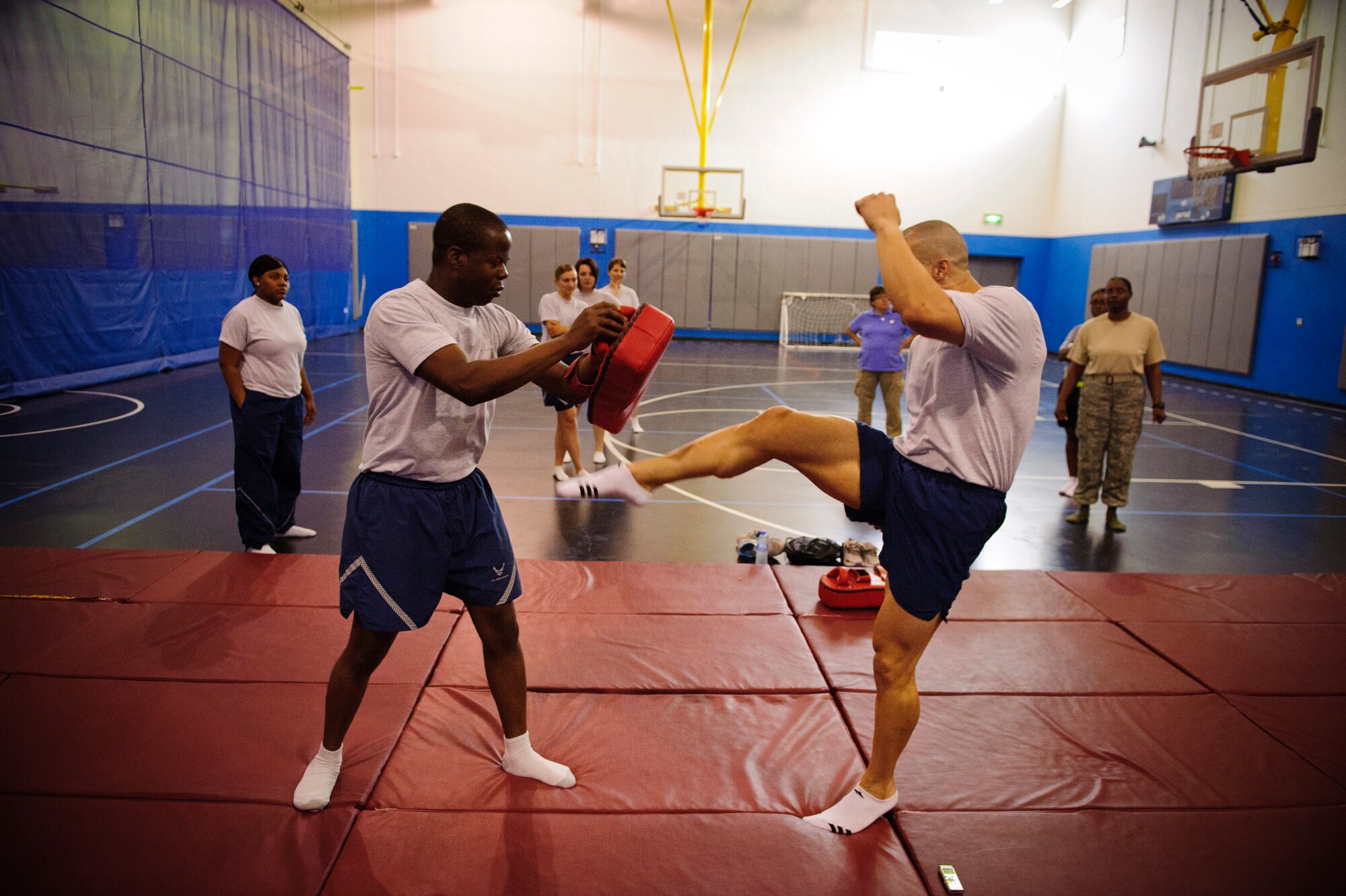 SOUTHWEST ASIA – Tech. Sgt. Ivan Abudo, 379th Expeditionary Communications Squadron, demonstrates how to kick during a self defense class here April 12, 2012. Abudo taught those in attendance about moves that would stun or hurt the attacker, giving them enough time to escape. (U.S. Air Force photo/Staff Sgt. Nathanael Callon)