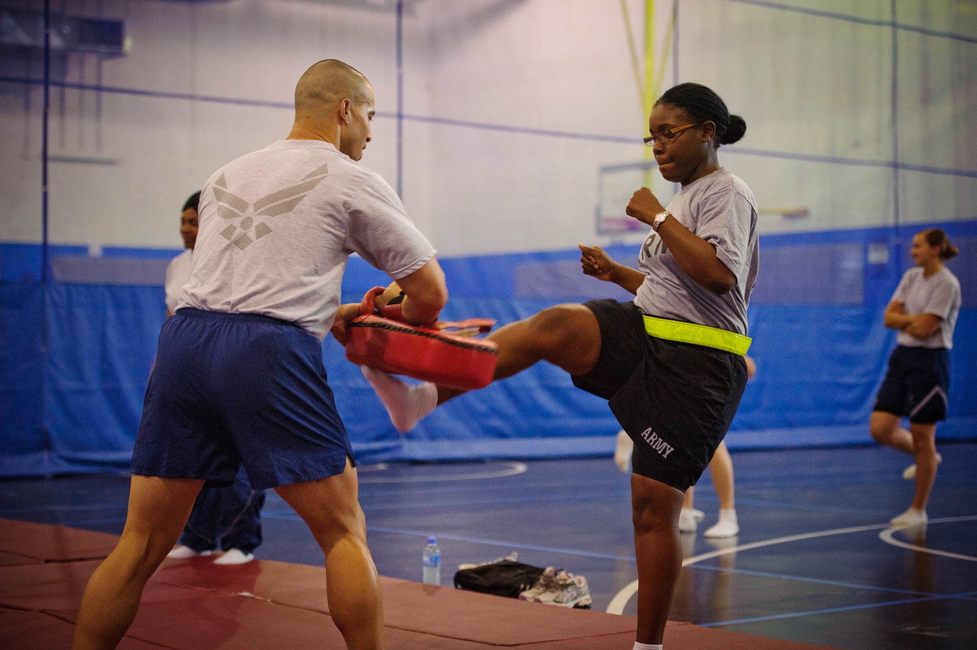SOUTHWEST ASIA – U.S. Army Spc. Donnette Haynesworth, 5-52nd Air and Missile Defense Battery, practices kicking a pad during a self defense class here April 12, 2012. The self defense class was held as a part of Sexual Assault Awareness Month to prepare members of the base for a worst-case scenario so they would be able to counter an attacker’s advances. (U.S. Air Force photo/Staff Sgt. Nathanael Callon)