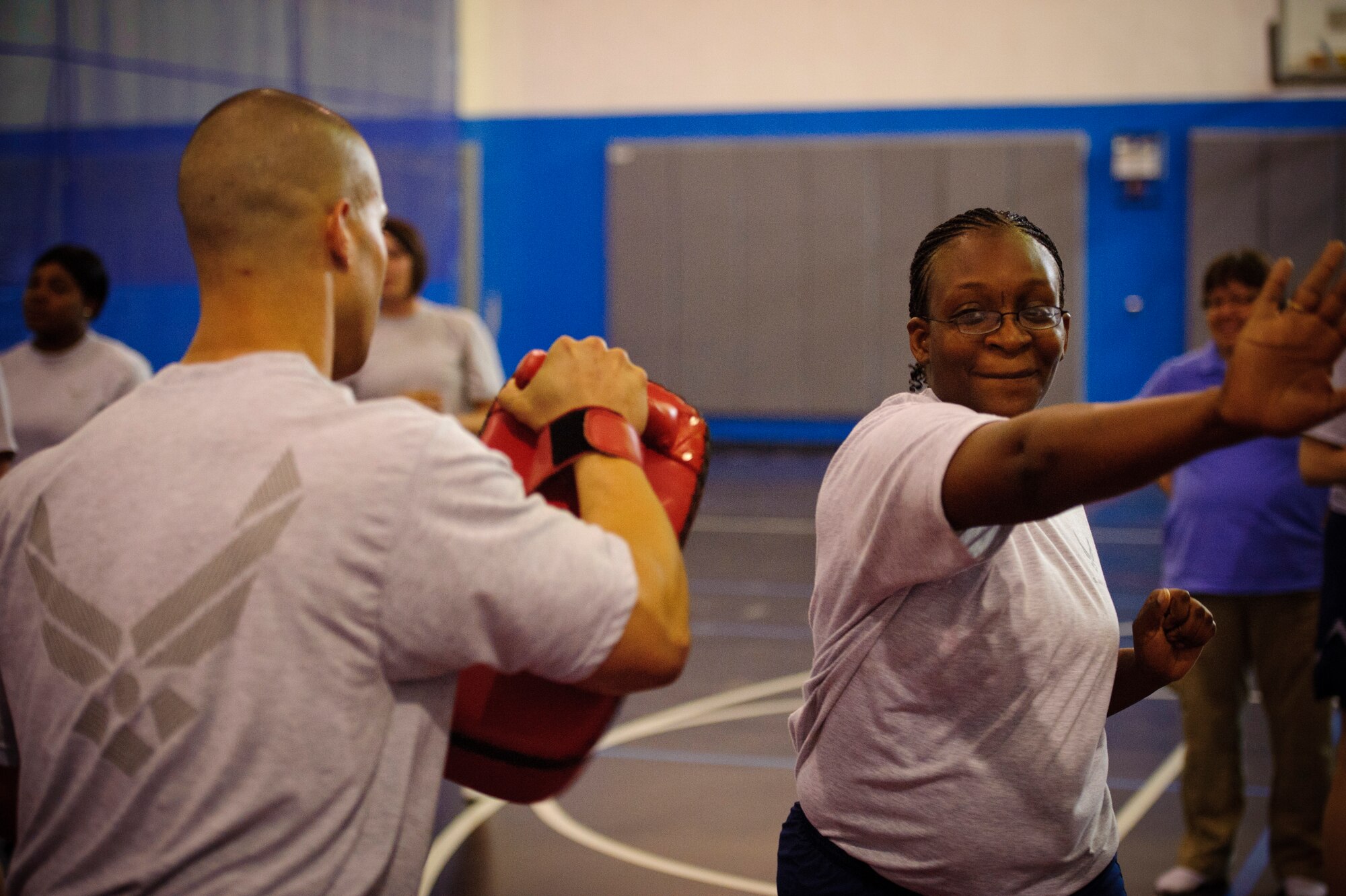SOUTHWEST ASIA – Staff Sgt. Renee Gilliam, 379th Air Expeditionary Wing, punches a pad during a self defense class here April 12, 2012. Attendees learned how to counter their attacker’s advances and how to avoid putting themselves in bad situations. (U.S. Air Force photo/Staff Sgt. Nathanael Callon)