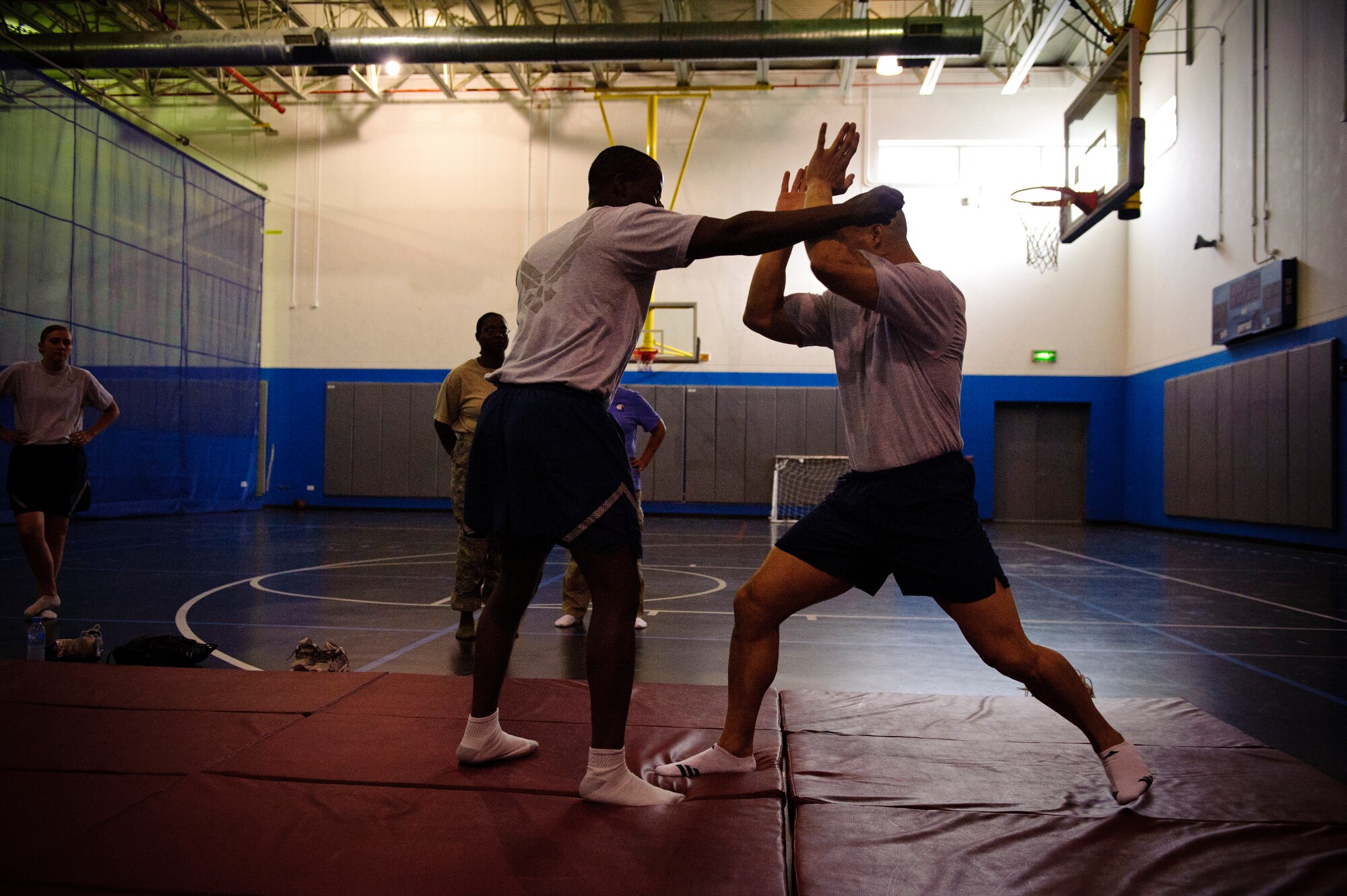 SOUTHWEST ASIA – Tech. Sgt. Ivan Abudo blocks a punch from Senior Airman Paul Salomon during a self defense class here April 12, 2012. Abudo taught those in attendance about moves that would stun or hurt the attacker, giving them enough time to escape. (U.S. Air Force photo/Staff Sgt. Nathanael Callon)