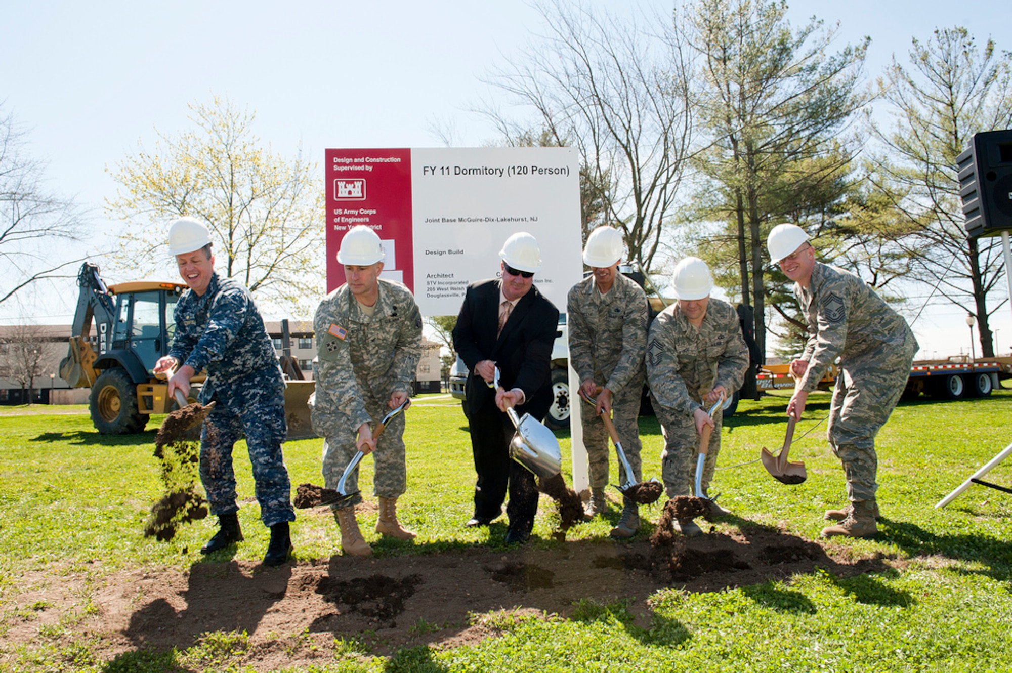 Navy Captain Andrew Butterfield, Joint Base McGuire-Dix-Lakehurst deputy commander, Col. John Boule, New York District Corp of Engineers commander, Mr. Tom Berry of Ranco Construction Southampton N.J., Chief Master Sgt. Samuel D'urso, 305th Operations Group superintendent, Chief Master Sgt. Terrance Greene 87th Air Base Wing command chief, and Chief Master Sgt. Patrick Marquette, 818th Contingency Response Group superintendent, take part in the dormitory ground-breaking ceremony April 5 here. The new dormitory will be constructed in the new Air Force standard of Dorm 4 Airmen. This standard highlights four Airmen per quad with private rooms/bathrooms, shared kitchen and living room area and private washer/dryer for each quad. This will be JB MDL's first D4A configured dormitory estimated to be complete May 2013. (U.S. Air Force Photo by Russ Meseroll/Released)
