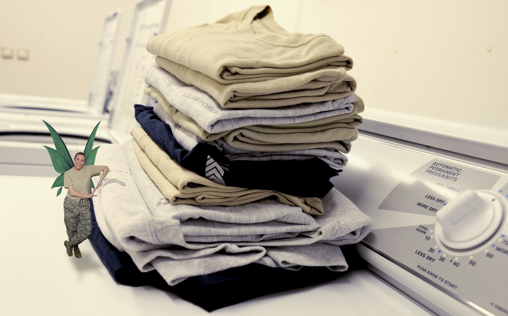 Master Sgt. Tracy DeMarco, a "laundry fairy", stands with a freshly folded pile of clothes April 13, 2012, at the Transit Center at Manas, Kyrgyzstan. Airmen here take care of each other -- sometimes unexpectedly. (U.S. Air Force graphic/Tech. Sgt. Aaron Drobnack)