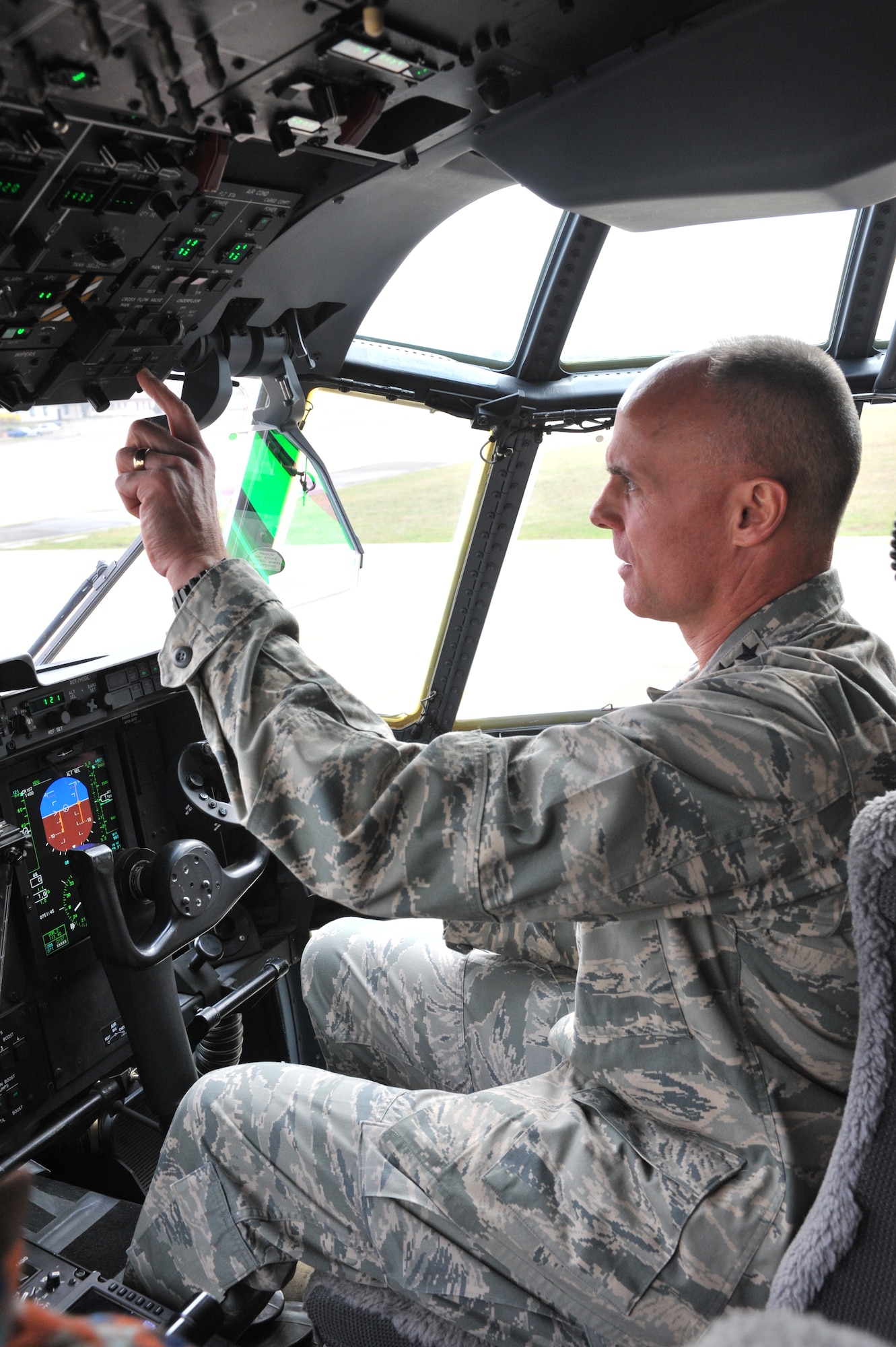 Lt. Gen. Craig Franklin, 3rd Air Force commander, sits in the pilot seat of a C-130J Super Hercules on Ramstein Air Base, Germany, April 11, 2012. This visit gave Franklin the opportunity to see firsthand the various capabilities each unit brings to the fight.  The immersion marked the first official visit since he assummed command on March 30. (U.S. Air Force photo/ Airman 1st Class Caitlin O'Neil-McKeown) 