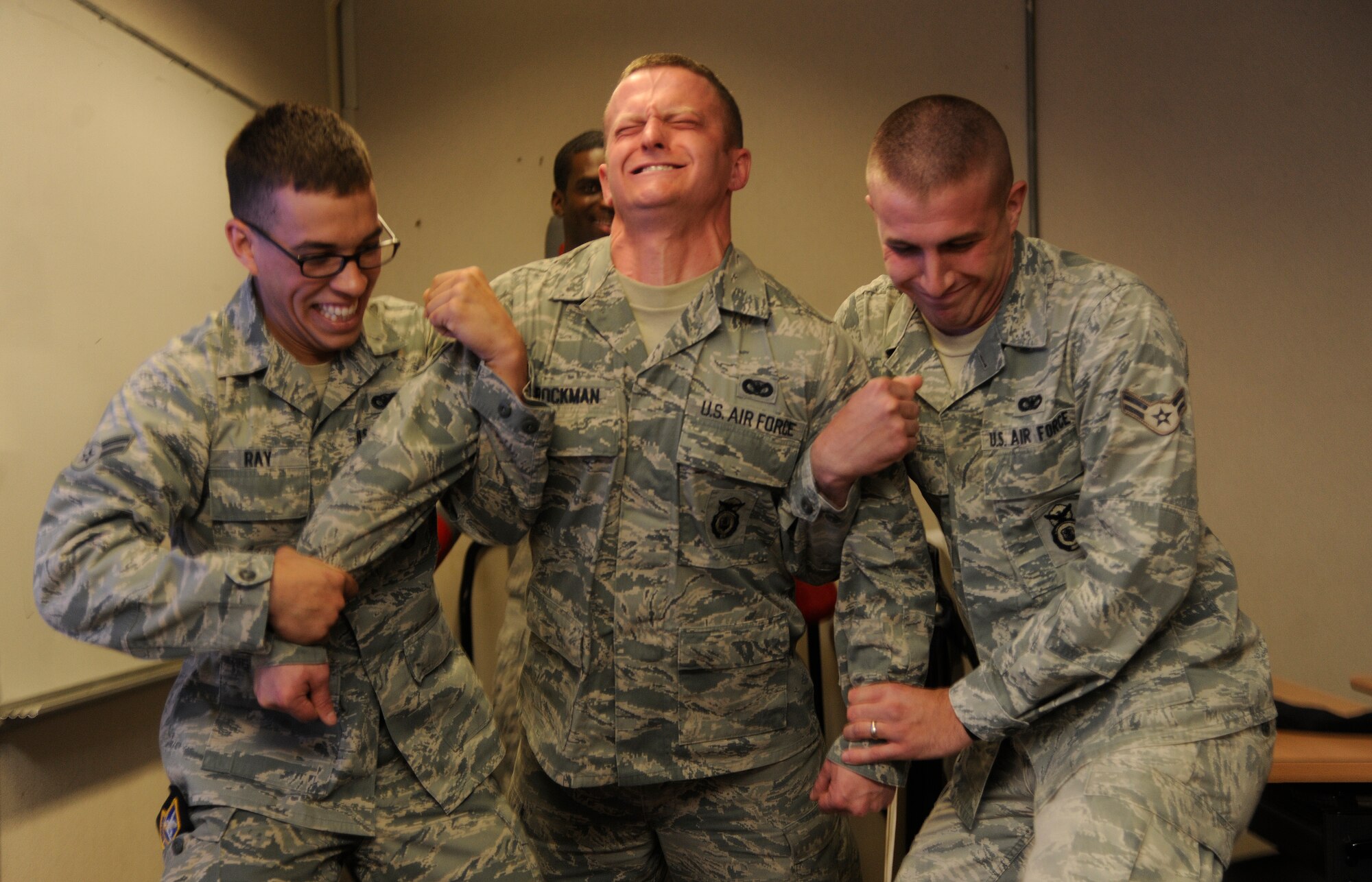 Senior Airman Thomas Brockman, 8th Security Forces Squadron member, feels the after effects of Taser during training at Kunsan Air Base, Republic of Korea, April 4, 2012. Brockman participated in the voluntary exposure, which lasted roughly five seconds, in order to become familiar with the capability. (U.S. Air Force photo/Staff Sgt. Rasheen A. Douglas)