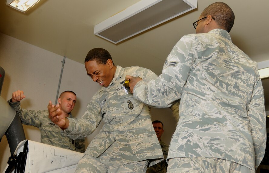 Airman 1st Class Johnie Graddy, 8th Security Forces Squadron member, gets stunned by a Taser gun during a training class at Kunsan Air Base, Republic of Korea, April 4, 2012. Security Forces members are shot with a Taser to get firsthand experience of the pain they might have to inflict in the course of their duties. (U.S. Air Force photo/Staff Sgt. Rasheen A. Douglas)