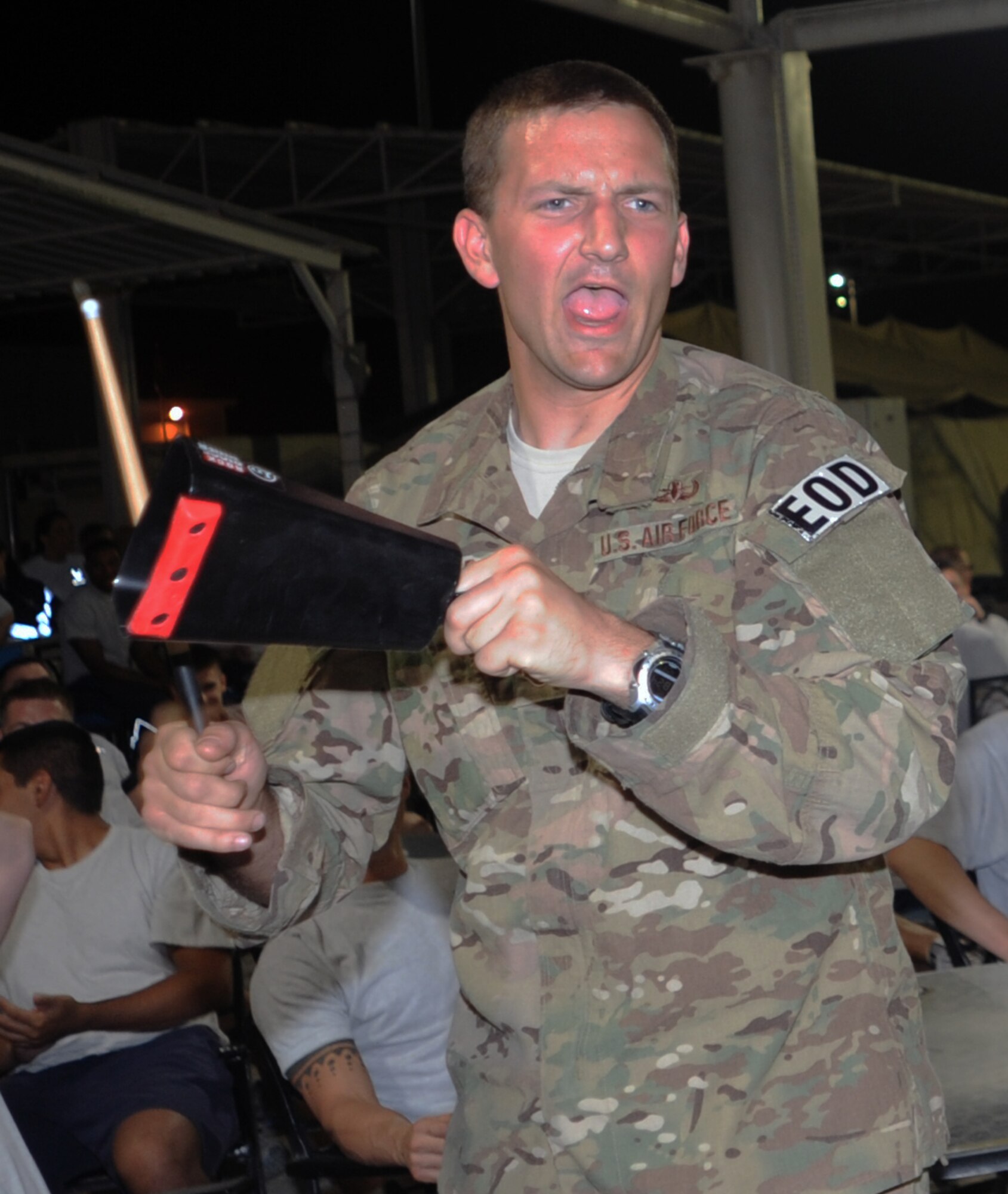 SOUTHWEST ASIA - Staff Sgt. Dustin Ballard rocks a cowbell during a concert by the U.S. Air Forces Central Band, Night Wing, April 9, 2012. The band played several shows while visiting the 380th Air Expeditionary Wing. In addition, they played a concert off base for students at a local university. Ballard is deployed from Joint Base Lewis-McChord, Wash. (U.S. Air Force photo/Staff Sgt. J.G. Buzanowski)