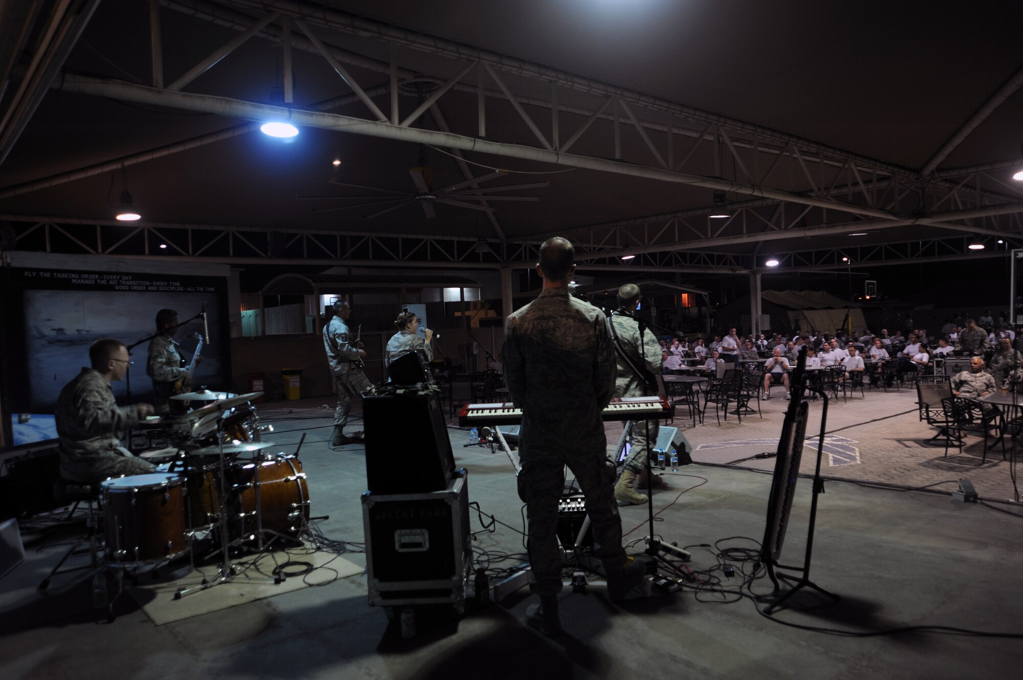 SOUTHWEST ASIA - The U.S. Air Forces Central Band, Night Wing, performs for members of the 380th Air Expeditionary Wing April 9, 2012. The band played several shows for people on base as well as for students at a local university. The seven members of Night Wing are deployed from Offutt Air Force Base, Neb., and will spend the majority of their deployment traveling to bases around the U.S. Central Command area of responsibility. (U.S. Air Force photo/Staff Sgt. J.G. Buzanowski)
