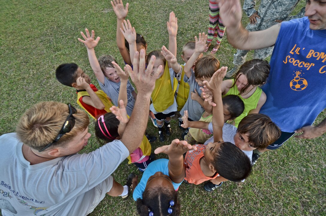 ANDERSEN AIR FORCE BASE, Guam – The Andersen Air Force Base 36th Wing Chapel staff stand for a group photo to receive the 2011 Air Force Outstanding Small Chapel Award April 11. The Chapel staff was selected as Pacific Air Forces best small chapel and went on to win the prestigious award of best in the Air Force. They were selected based on wing mission impact, management, training, ministries and programs offered.(U.S. Air Force photo illustration by Senior Airman Jeffrey Schultze)