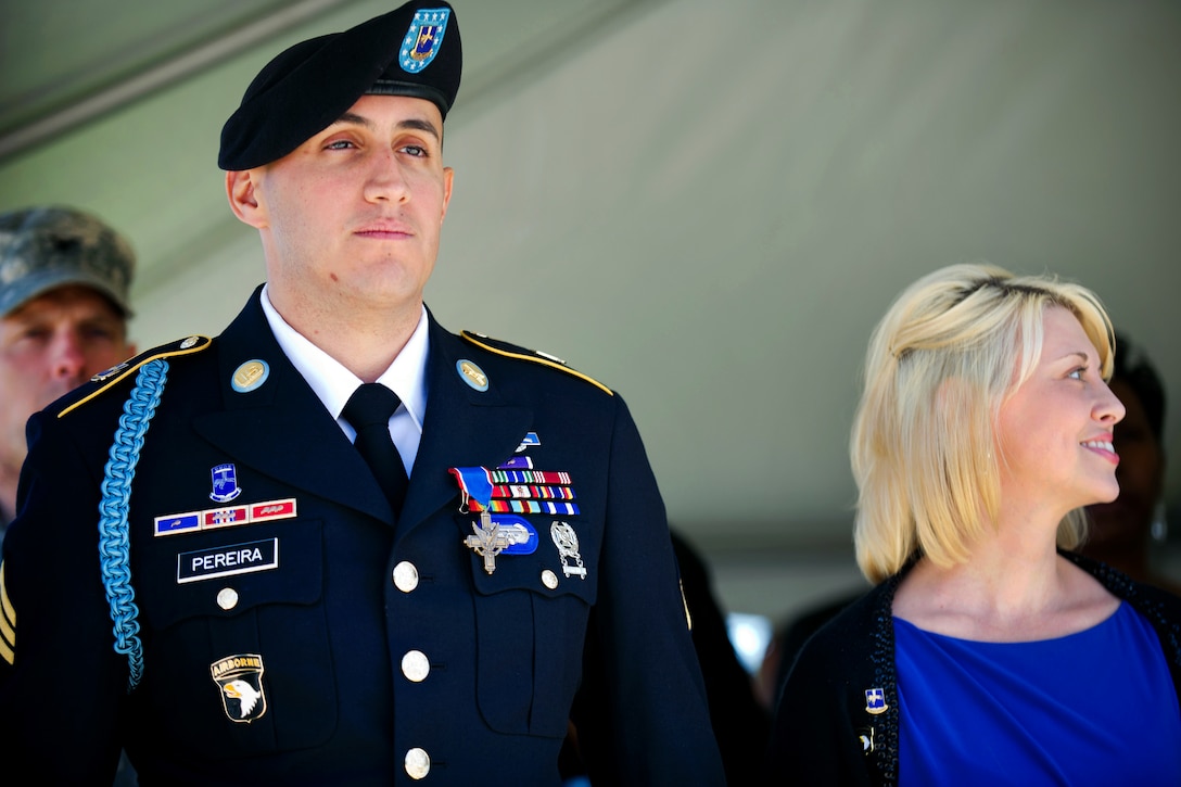 Army Sgt. Felipe Pereira stands next to his wife, Candie, after receiving the Distinguished Service Cross at McAuliffe Hall on Fort Campbell, Ky., April 12, 2012.