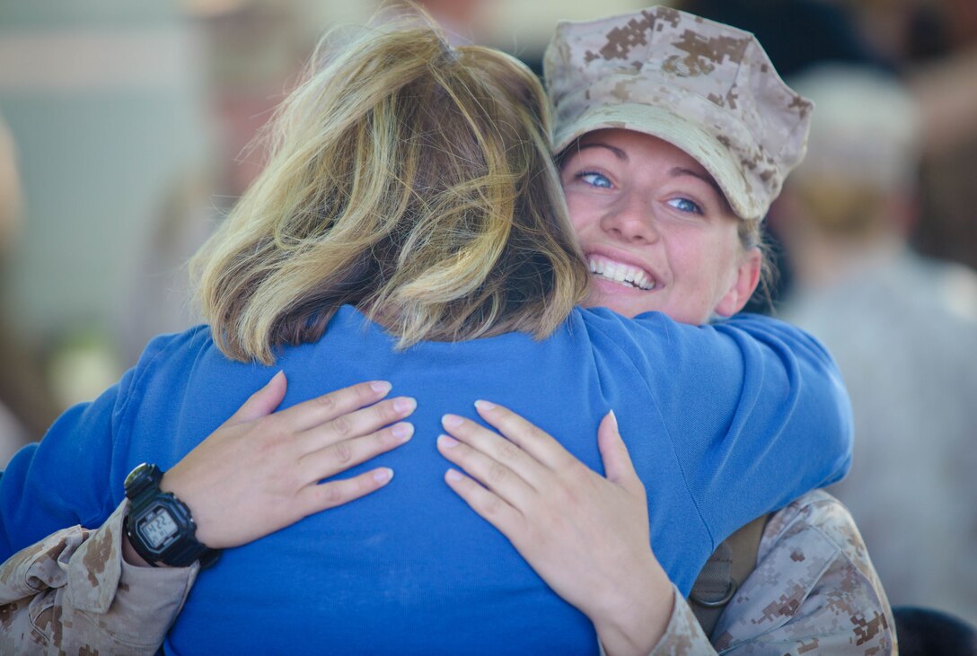 A Marine with II Marine Expeditionary Force Headquarters Group embraces her mother during a welcome home celebration, April 12, at Camp Lejeune, N.C. They returned home after a yearlong deployment to Helmand Province, Afghanistan.