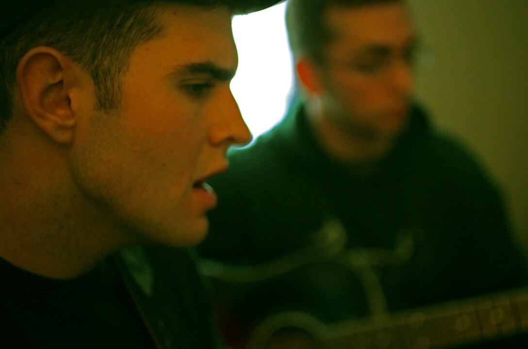 Petty Officer 3rd Class William Moon, a Ulysses, Pa., native focuses on sheet music while practicing with his band “The Tilton Effect” April 13.  The band is comprised of two sailors, including Moon, from Headquarters Battalion, 2nd Marine Division.  The Tilton Effect can be seen occasionally performing cover songs in areas surrounding Marine Corps Base Camp Lejeune, N.C. (Official U.S. Marine Corps photo by Cpl. Clayton VonDerAhe)