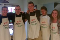 Recruiting Substation Burnsville's Patrick Massey, Sgt. Joshua Draveling, Andrew Morris, Jeremy Kaiser and Anna Albrecht set aside their hair nets for a few moments to take a photo during the Evergreen Community Church's Kids Against Hunger packing session April 14. Overall, 165 volunteers spent the day packaging more than 67,000 meals.