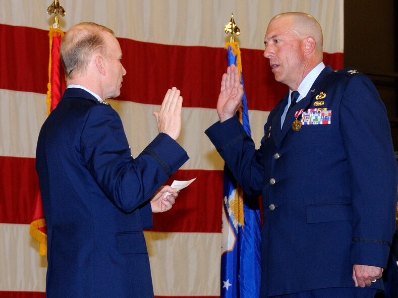 Col. Thomas Anderson, then-188th Fighter Wing commander, left, swears in then-Lt. Col. Peter Gauger as 188th Fighter Wing vice commander during a formal ceremony April 14. Gauger was also promoted to colonel during the ceremony. (National Guard photo by Airman 1st Class Hannah Landeros/188th Fighter Wing Public Affairs)
