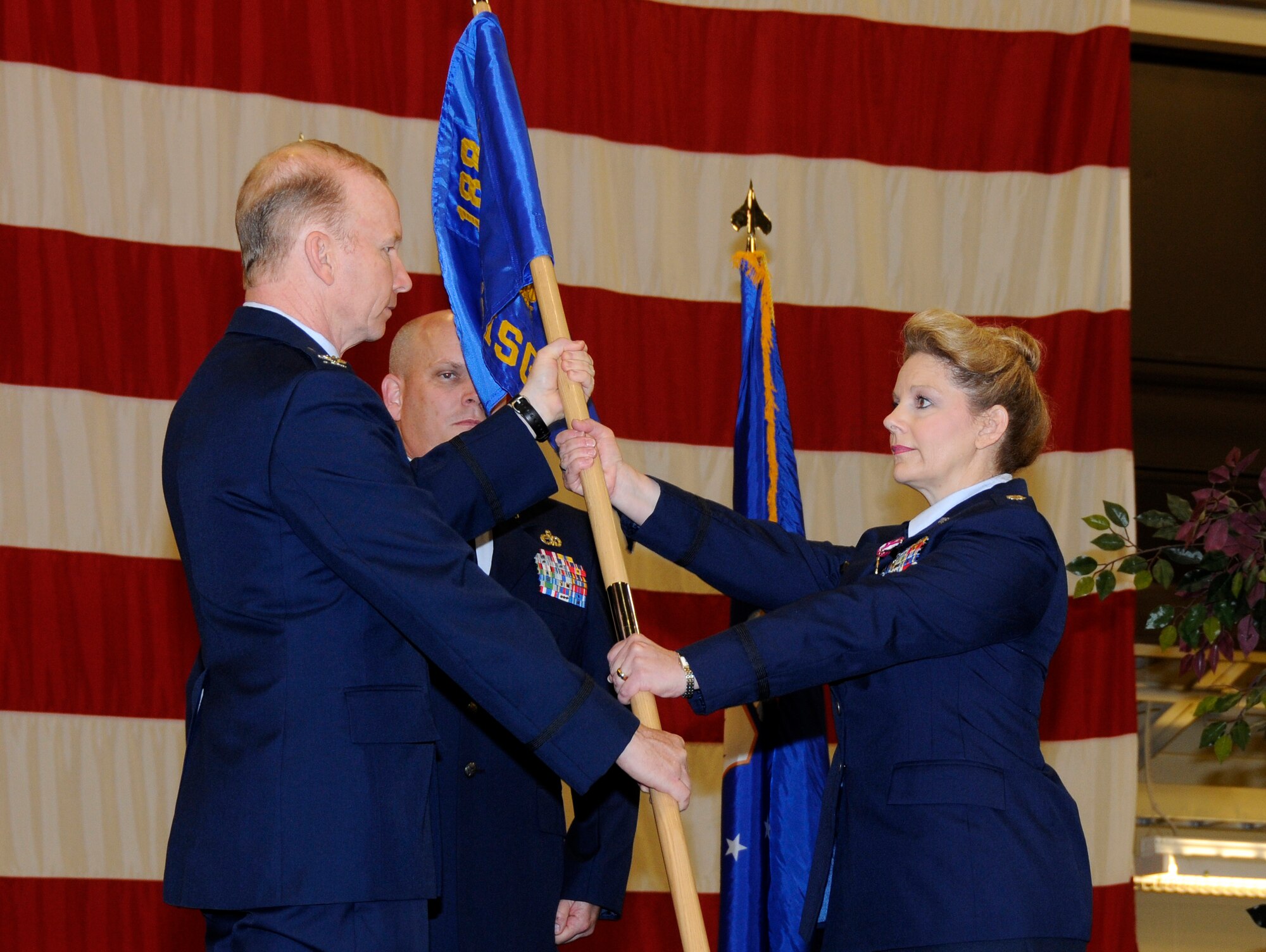 New 188th Mission Support Group commander, Lt. Col. Tenise Gardner, right, takes the 188th Mission Support Group guide-on from Col. Thomas Anderson, then-188th Fighter Wing commander, during a formal change-of-command ceremony April 14. (National Guard photo by Airman 1st Class Hannah Landeros/188th Fighter Wing Public Affairs)