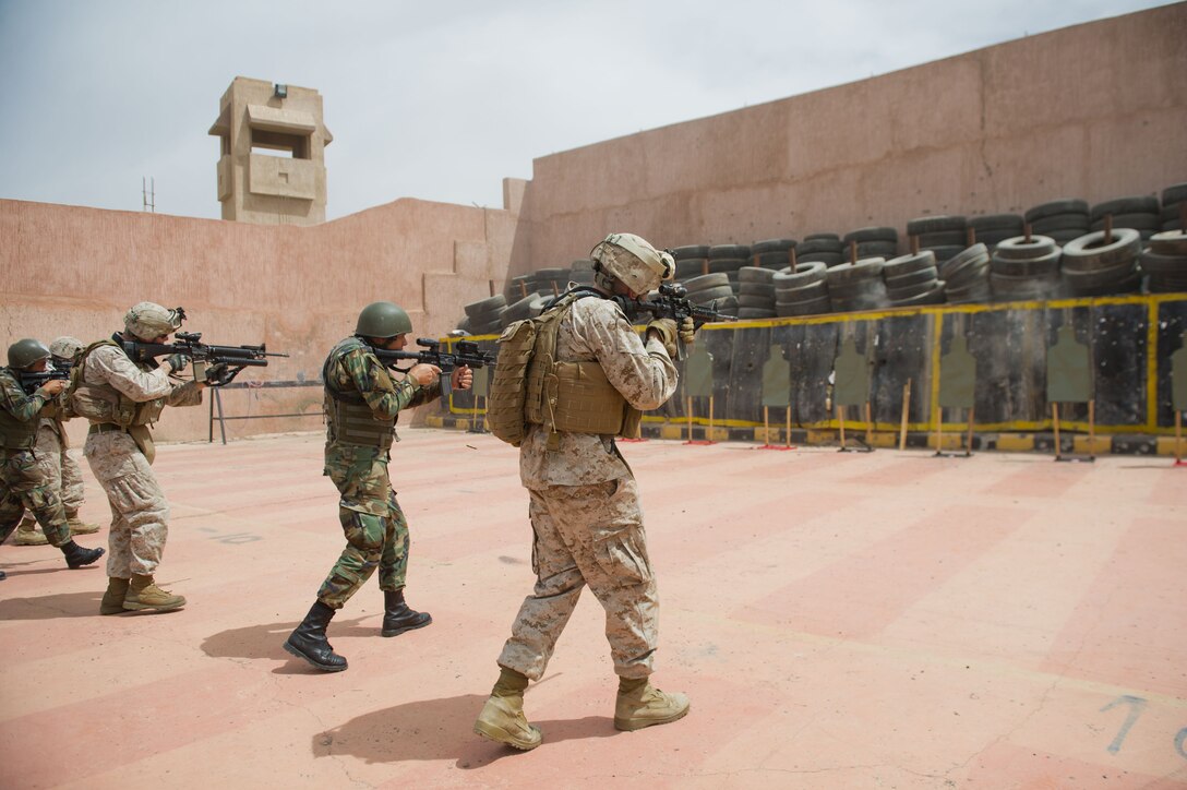 Marines assigned to Battalion Landing Team 3/1, 11th Marine Expeditionary Unit and members of the Jordanian Armed Forces fire rifles during training here April 14. The landing team serves as the ground combat element for the 11th MEU and is deployed as part of the Makin Island Amphibious Ready Group, currently a U.S. Central Command theater reserve force. The group is providing support for maritime security operations and theater security cooperation efforts in the U.S. 5th Fleet area of responsibility.