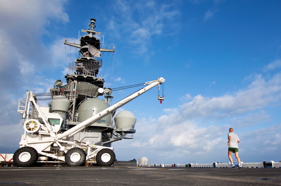 Maj. James Kay, 26th Marine Expeditionary Unit fires officer, runs on the flight deck of USS Wasp (LHD-1) while under way to New Orleans, L.A., April 13, 2012. The 26th MEU is currently providing support to the Commemoration of the Battle of New Orleans. Starting this April and continuing through 2015, the U.S. Navy, U.S. Marine Corps and U.S. Coast Guard will commemorate the Bicentennial of the War of 1812 and the Star Spangled Banner. The War of 1812 celebration will commemorate the rich Naval history and showcase the capabilities of today's Navy-Marine Corps team. (U.S. Marine Corps graphic by Cpl. Christopher Q. Stone/Released)  ::r::::n::::r::::n::
