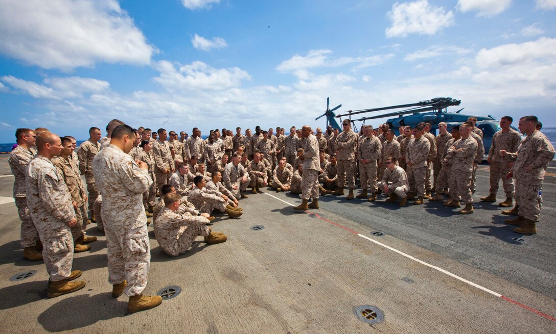 Master Sgt. John Collins, 26th Marine Expeditionary Unit headquarters commandant, speaks to the Marines and sailors of 26th MEU and Company C, 1st Battalion, 6th Marine Regiment on the flight deck of USS Wasp (LHD-1) while under way to New Orleans, L.A., April 13, 2012. The 26th MEU is currently providing support to the Commemoration of the Battle of New Orleans. Starting this April and continuing through 2015, the U.S. Navy, U.S. Marine Corps and U.S. Coast Guard will commemorate the Bicentennial of the War of 1812 and the Star Spangled Banner. The War of 1812 celebration will commemorate the rich Naval history and showcase the capabilities of today's Navy-Marine Corps team. (U.S. Marine Corps graphic by Cpl. Christopher Q. Stone/Released)  ::r::::n::::r::::n::