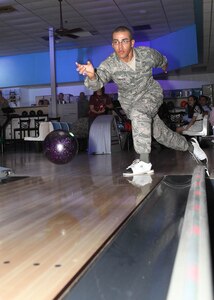Airman 1st Class Juan Batista, 326th Training Squadron, Flight 261, gets to bowl with his family April 5 at the Skylark Bowling Center before graduating from basic training the next day. The bowling center caters to soon-to-be Airmen and their families during Air Force Basic Military Training graduation week. (U.S. Air Force photo/Robbin Cresswell)