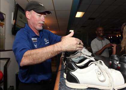 Steve Blake, Skylark Bowling Center duty manager, sprays bowling shoes before putting them away for the next customer April 5 at the Skylark Bowling Center. Innovations in customer service and new programs led to the Skylark’s recent selection as the best bowling center in the Air Force. (U.S. Air Force photo/Robbin Cresswell)