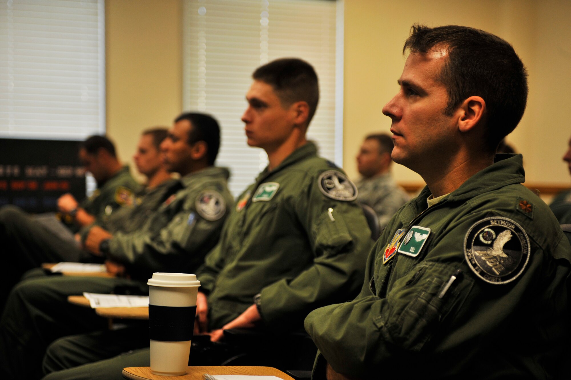 Airmen from the 4th Fighter Wing attend a mission briefing for Mustang Mayhem April 13, 2012, at Seymour Johnson Air Force Base, N.C. Mustang Mayhem will take place April 16 and will involve more than 70 F-15E Strike Eagles lining up on the runway to demonstrate the wing's capability to generate air power. The jets will then launch for an exercise modeled after a World War II battle 70 years ago. (U.S. Air Force courtesy photo)