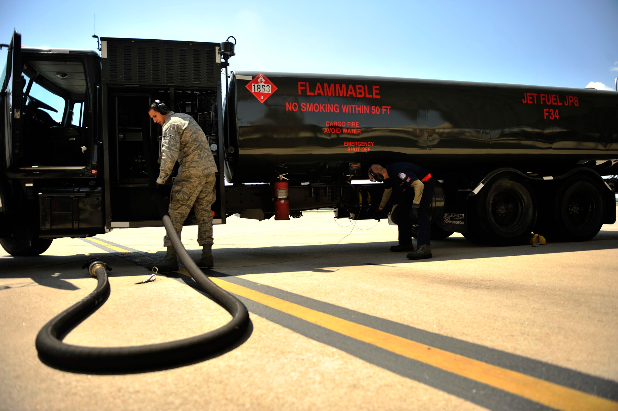 Airman 1st Class Timothy Schnitzer stows a refueling hose after refueling an F-15E Strike Eagle aircraft April 13, 2012, at Seymour Johnson Air Force Base, N.C. Airmen at the base are preparing for Mustang Mayhem on April 16 that will involve more than 70 F-15E Strike Eagles lining up on the runway to demonstrate the wing's capability to generate air power. The jets will then launch for an exercise modeled after a World War II battle 70 years ago. Schnitzer is assigned to the 4th Logistics Readiness Squadron. (U.S. Air Force courtesy photo)