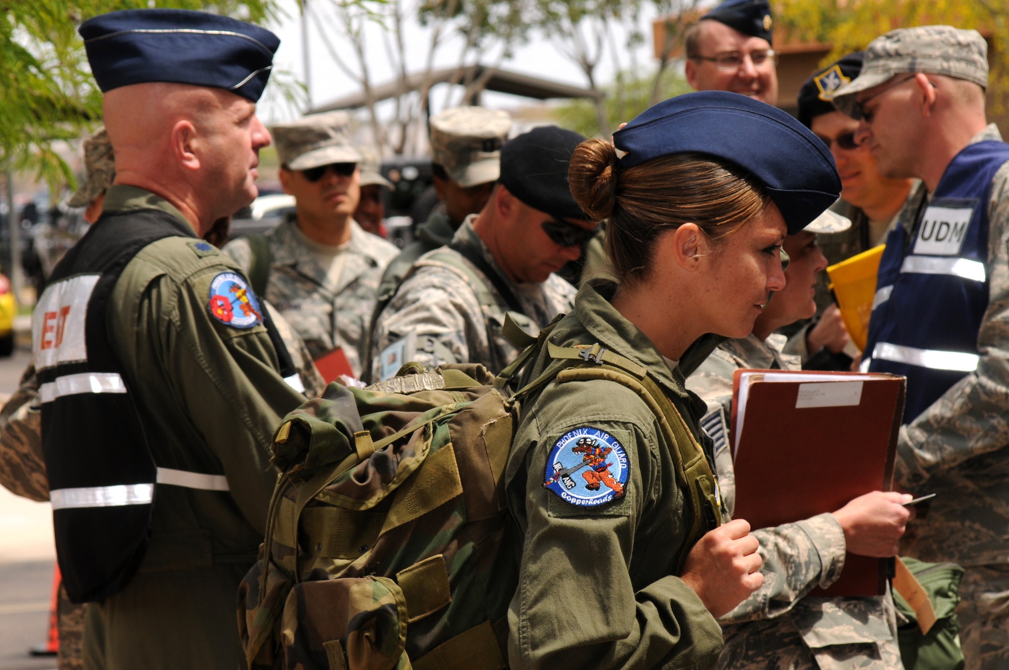 Airmen from the 161st Air Refueling Wing process a personnel deployment function line during an exercise April 14, 2012 at Phoenix Sky Harbor Air National Guard Base. The PDF line is simulated to prepare Airmen for a real-world experience. (Photo by Senior Airman Rashaunda Williams/Released)
