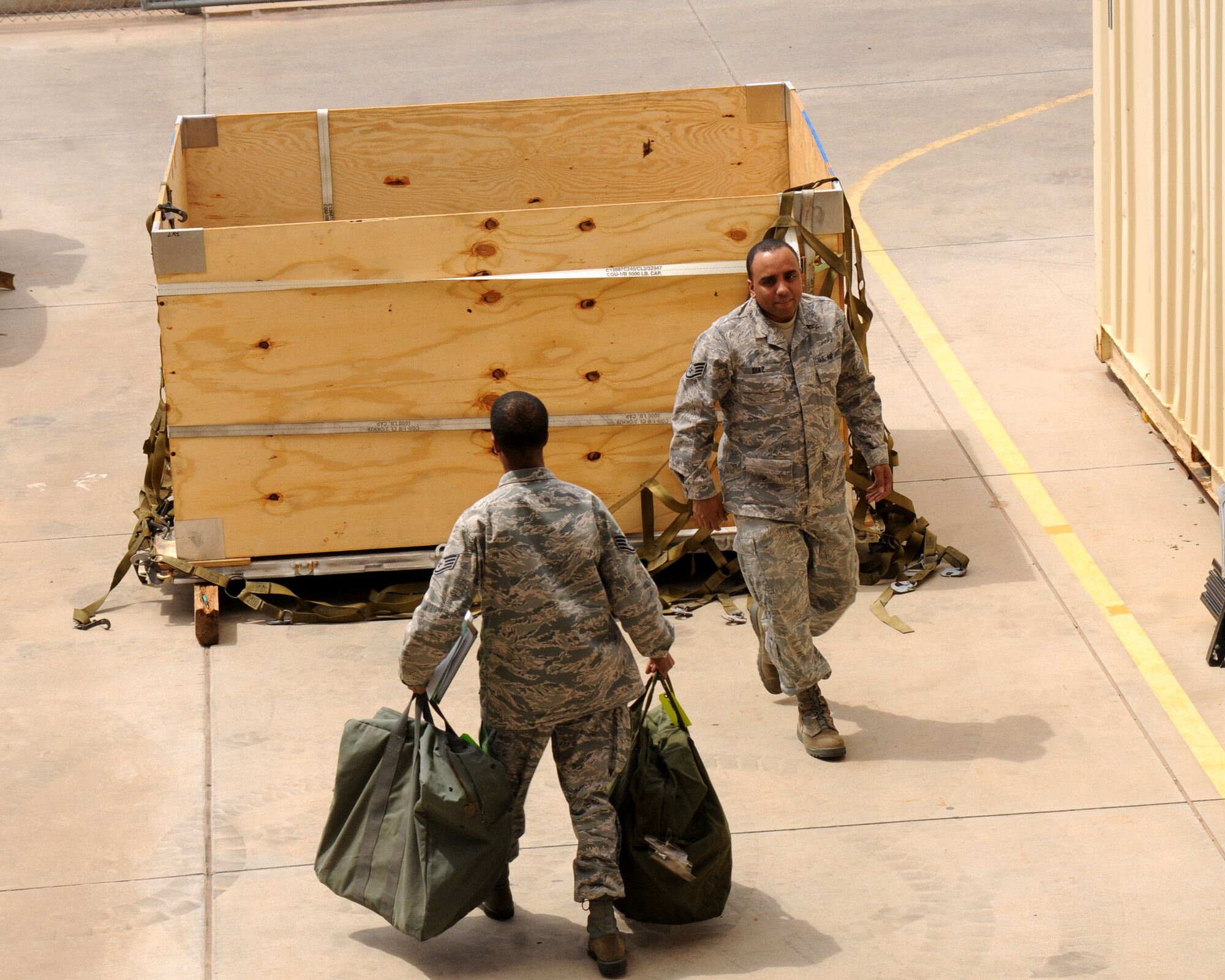 Airmen from the 161st Air Refueling Wing put A-Bags into cargo pallets April 14, 2012 at Phoenix Sky Harbor Air National Guard Base. A-Bags are filled with supplies such as sleeping bags, medical supplies and chemical gear.(Photo by Senior Airman Rashaunda Williams/Released)