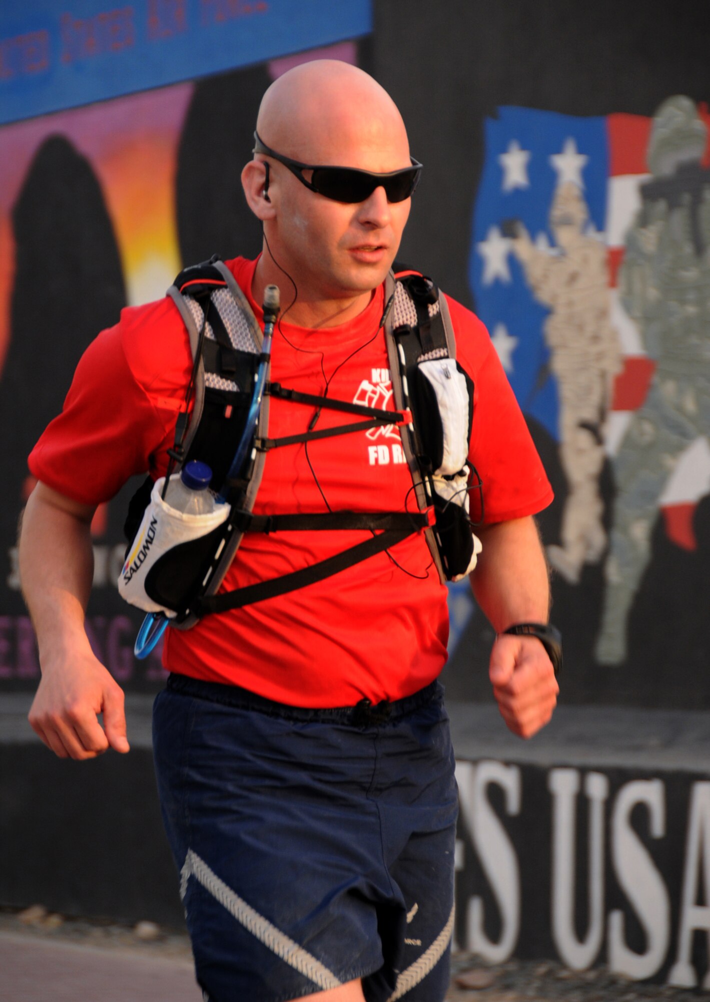 U.S. Air Force Tech. Sgt. Wayne Jenderny, 386th Expeditionary Civil Engineering Squadron firefighter, runs with the goal of reaching 100 miles in less than 24 hours at an undisclosed location, Southwest Asia, April 7, 2012. Jenderny, Minnesota Air National Guard member deployed from the 148th Fighter Wing and native of Eyota, Minn., ran 100 miles in less than 24 hours to raise awareness and take donations for a fellow firefighter's daughter who is suffering from a painful nerve disorder. (U.S. Air Force photo by Staff Sgt. James Lieth)