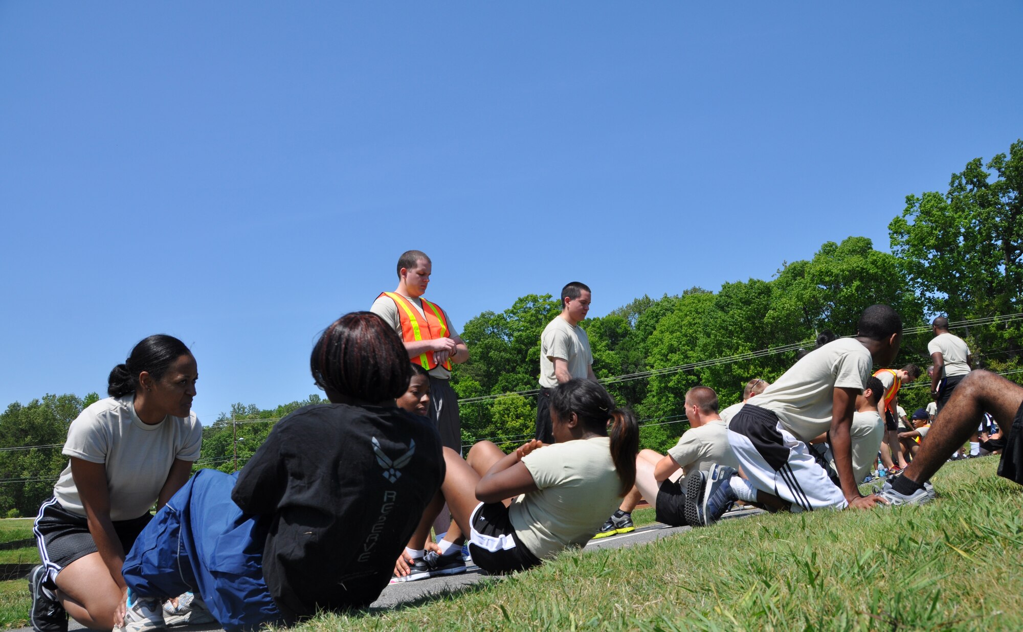 Recruits from the Developmental and Training Flight, or D&TF, are divided into three groups to conduct physical conditioning training held here Saturday, April 14. The D&TF was established to expand on the previous Delayed Entry Program and includes physical training sessions, military customs and courtesies, Air Force core values, and marching movements. With the new program in place, recruits are expected to participate the full UTA weekend. (U.S. Air Force photo/Senior Airman Chelsea Smith).