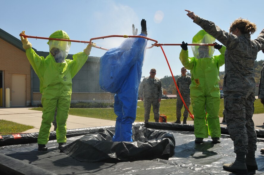 Airmen from the 148th Fighter Wing, Duluth, Minn., the 183rd FW, Springfield, Ill., and the 115th FW practice decontamination techniques and other emergency management skills at Volk Field Combat Readiness Training Center April 12-15. (U.S. Air Force photo by Senior Airman Ryan Roth)