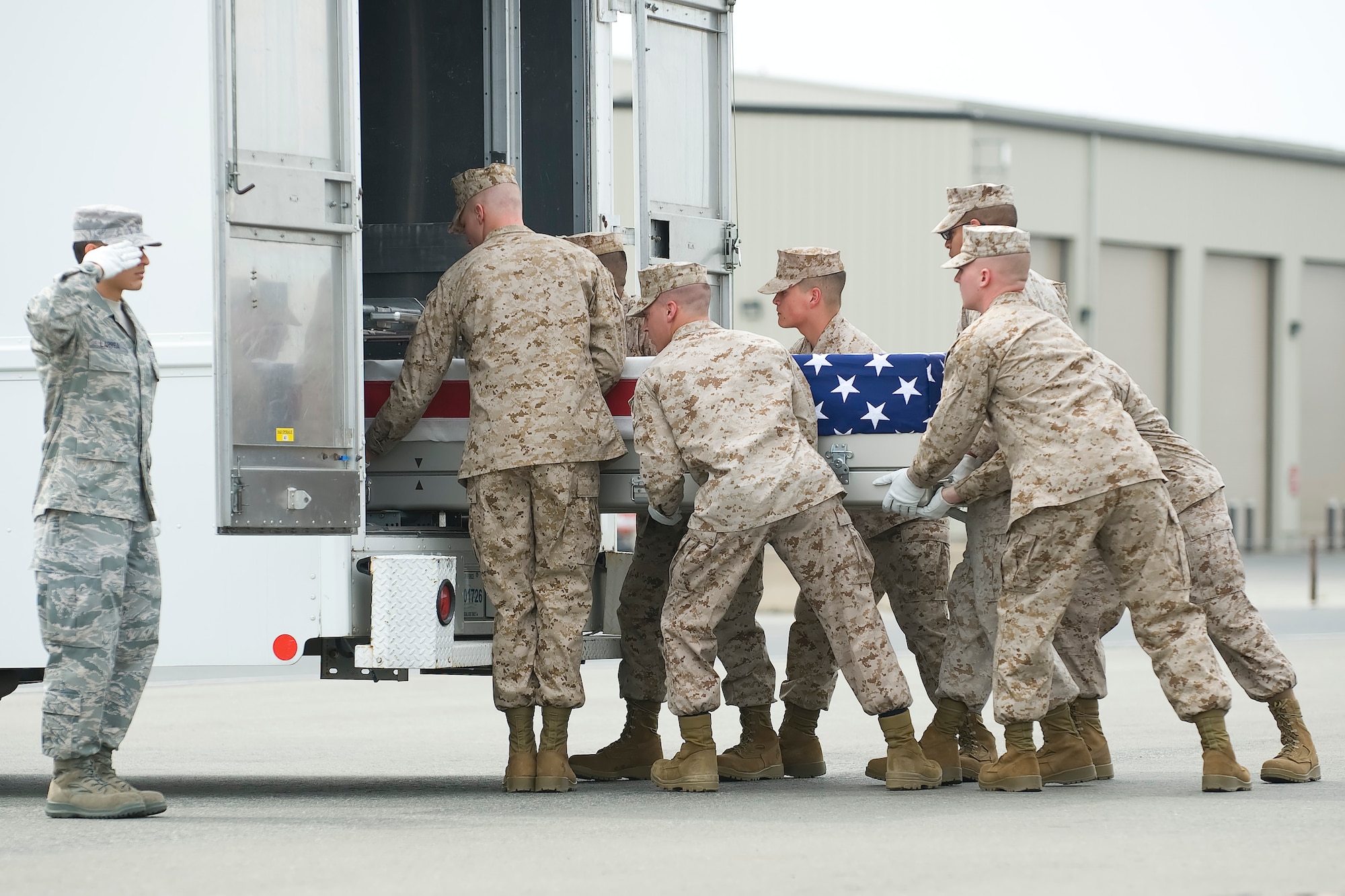 A U.S. Marine Corps carry team transfers the remains of Lance Cpl. Ramon T. Kaipat, at Dover Air Force Base, Del., April 14, 2012. Kaipat was assigned to the 1st Light Armored Reconnaissance Battalion, 1st Marine Division, I Marine Expeditionary Force, Camp Pendleton, Calif. (U.S. Air Force photo/Adrian R. Rowan)
