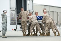 A U.S. Marine Corps carry team transfers the remains of Lance Cpl. Ramon T. Kaipat, at Dover Air Force Base, Del., April 14, 2012. Kaipat was assigned to the 1st Light Armored Reconnaissance Battalion, 1st Marine Division, I Marine Expeditionary Force, Camp Pendleton, Calif. (U.S. Air Force photo/Adrian R. Rowan)