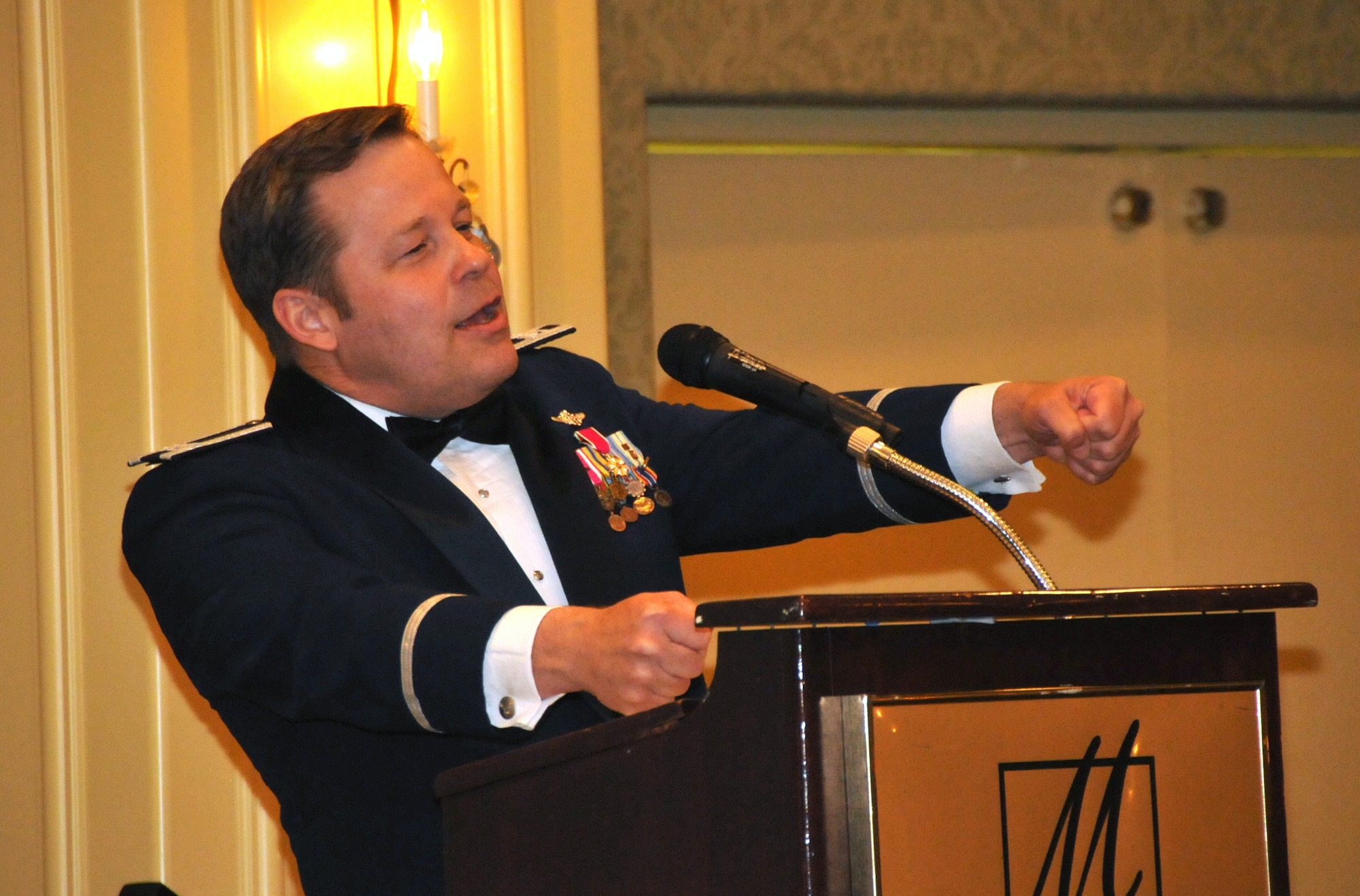 Colonel (Dr.) Brett A. Wyrick, USAF lightens the mood at the 185th Air Refueling Wing Military Ball on April 14, 2012 at the Marina Inn in South Sioux City, Neb. Col. Wyrick serves as the Air Surgeon, National Guard Bureau, Washington, D.C. and as the Director of the Medical Service on the staff of the Director of the Air National Guard. (Air Force Photo by TSgt Brian Cox. Released)