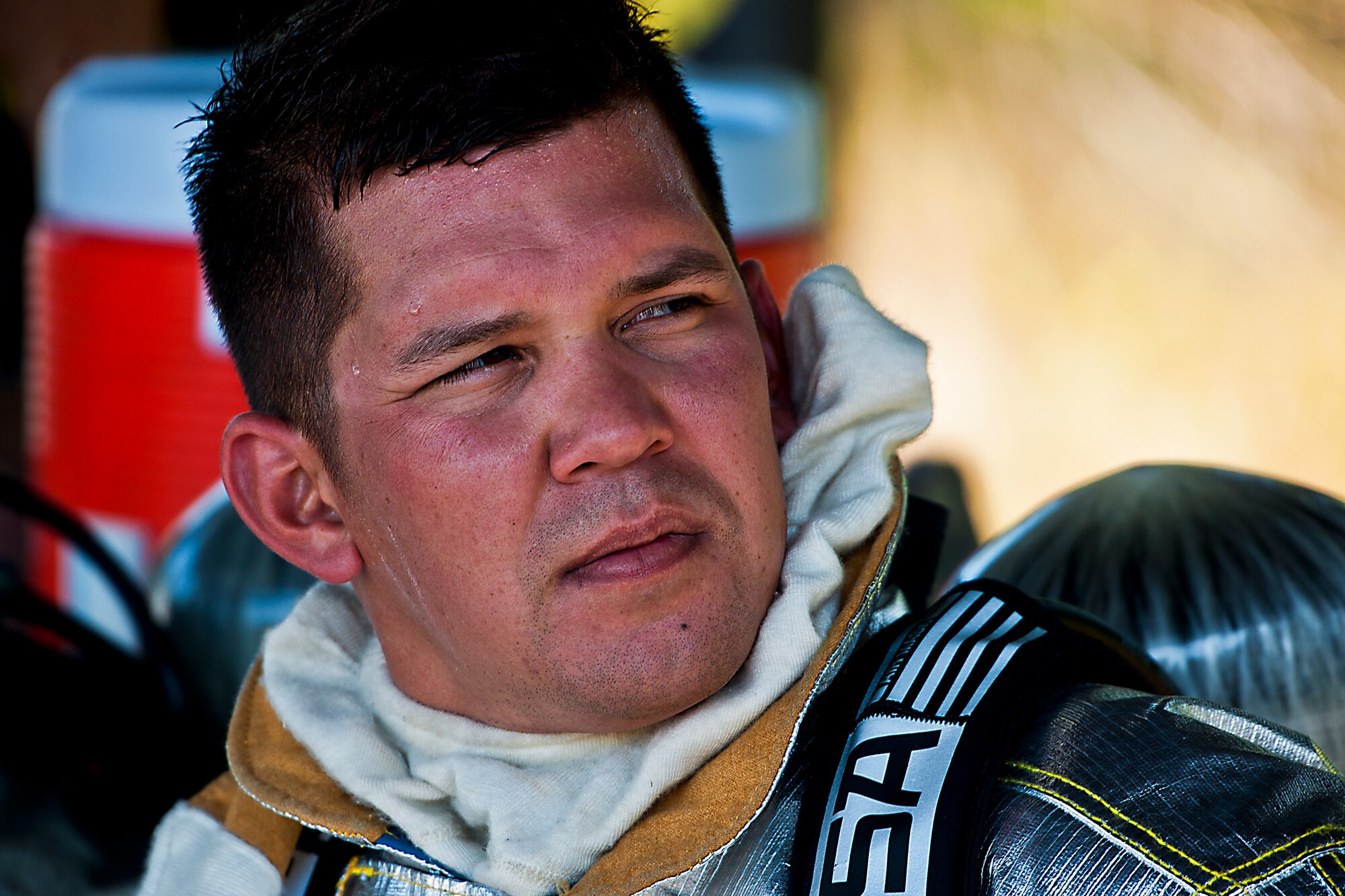 Senior Airman James Weslowski, a 919th Special Operations Wing firefighter, takes a break between aircraft fire training scenarios at Hurlburt Field, Fla., April 13.  More than 10 of Duke Field’s firemen braved the flames of the aircraft burn pit for this annual refresher training.  (U.S. Air Force photo/Tech. Sgt. Samuel King Jr.)