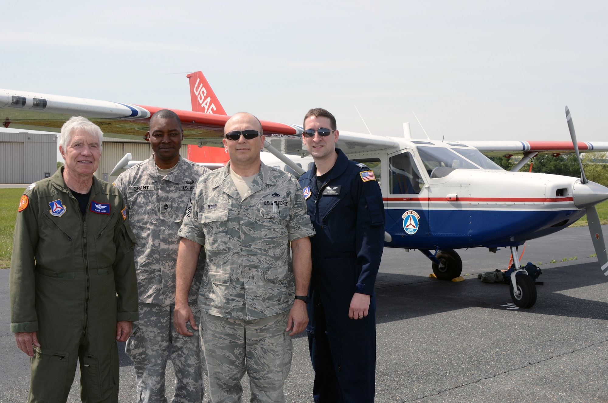 (L-R) CAP Capt. Patrick Aaron, U.S. Army Sgt. 1st Class Matthew J. Grant, U.S. Air Force Master Sgt. Clyde J. Wood, and CAP Capt. Jonathan Neumann, complete a training mission over the C and D canal, a body of water connecting the Chesapeake and Delaware Bays, with the Geospatial Information Interoperability Exploitation-Portable system at Warfield Air National Guard Base, Baltimore, MD on April 14, 2012.  The GIIEP system gives incident commanders on the ground real time images in emergency situations and the Air and Army National Guard work with the CAP in operating the system. (National Guard Photo By Staff Sgt. Benjamin Hughes/RELEASED)