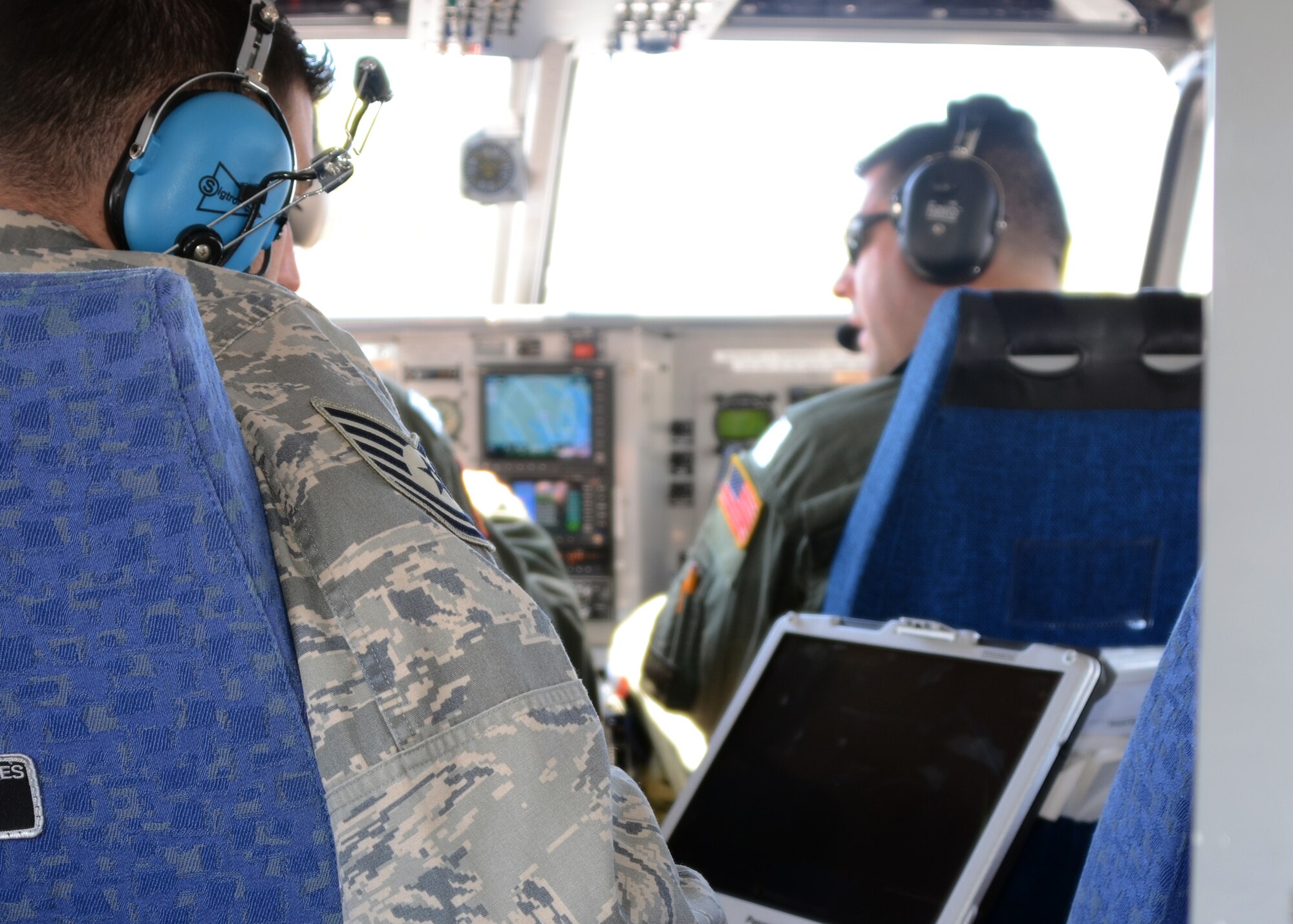 U.S. Air Force Tech. Sgt. Elvis Parlar, a Geospatial Information Interoperability Exploitation-Portable (GIIEP) operator from the 175th Wing Communication Squadron, Maryland Air National Guard, operates a camera transmitting real time images on April 13, 2012 while members of the Maryland Wing Civil Air Patrol fly a GA-8 aircraft from Warfield Air National Guard Base, Baltimore, MD. The GIIEP system gives incident commanders on the ground images in emergency situations and the Air and Army National Guard work with the CAP in operating the system. (National Guard Photo By Master Sgt. Ed Bard/RELEASED)