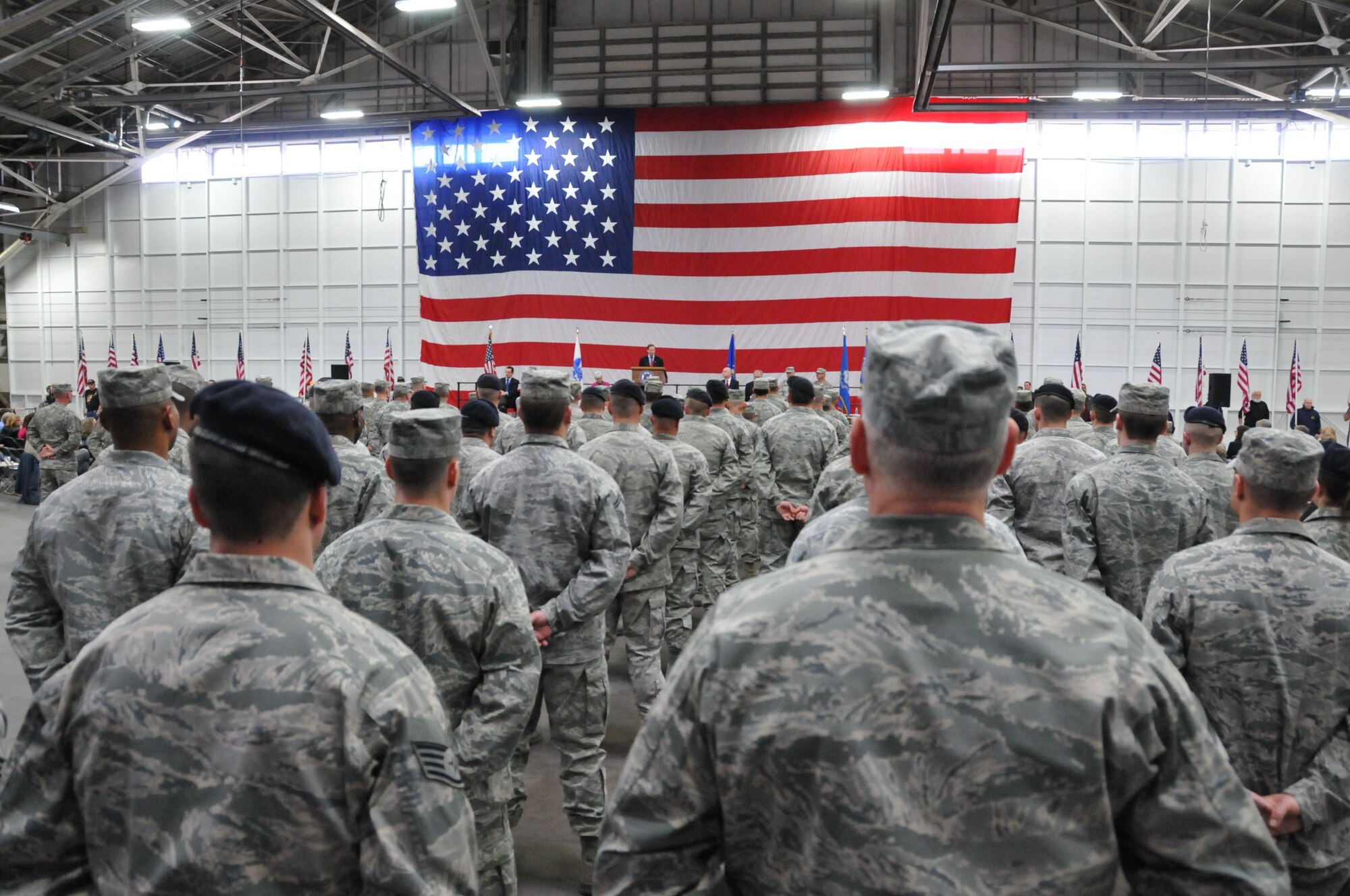Airmen from the 103rd Civil Engineer Squadron, the 103rd Security Forces Squadron and the 103rd Air Operations Group stand at parade rest while Connecticut Governor Dannel P. Malloy addresses them along with Army National Guardsmen during a Joint Freedom Salute Ceremony in the main hangar at Bradley Air National Guard Base in East Granby, Conn. March 31, 2012. Airmen and Soldiers of the Connecticut National Guard were formally welcomed home and honored following deployments over the past year. (U.S. Air Force photo by Tech. Sgt. Erin McNamara\RELEASED)