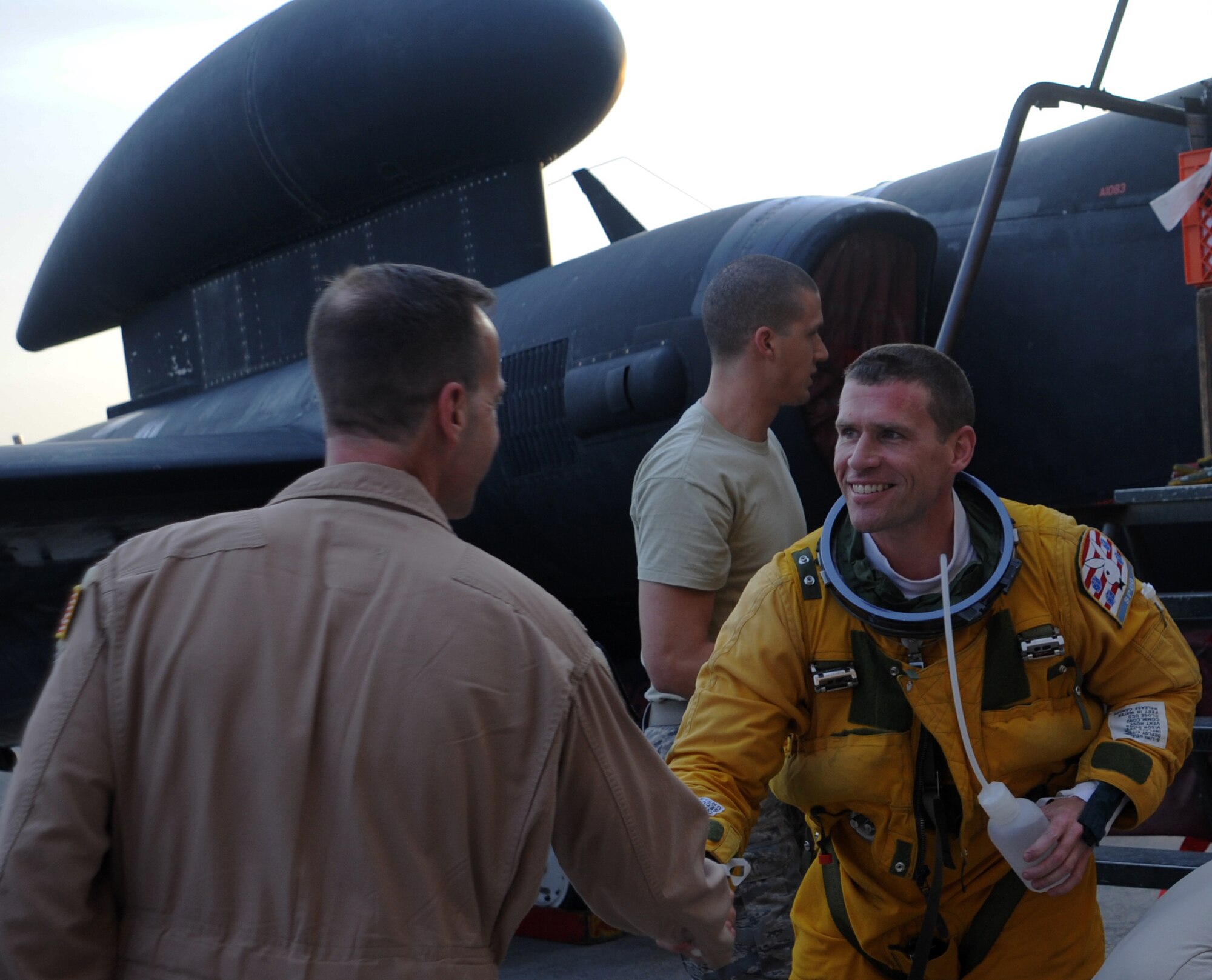 SOUTHWEST ASIA - Lt. Col. Andrew shakes hands with Col. Jay Bickley on the flightline at the 380th Air Expeditionary Wing April 14, 2012. Andrew had just returned from a sortie in which he recorded his 1,000th flight hour in the U-2. Bickley is the commander of the 380th Expeditionary Operations Group. Andrew, deployed from Beale Air Force Base, Calif., is the 99th Expeditionary Reconnaissance Squadron commander. For security reasons, U-2 pilots can only be identified by their first names. (U.S. Air Force photo/Staff Sgt. J.G. Buzanowski)