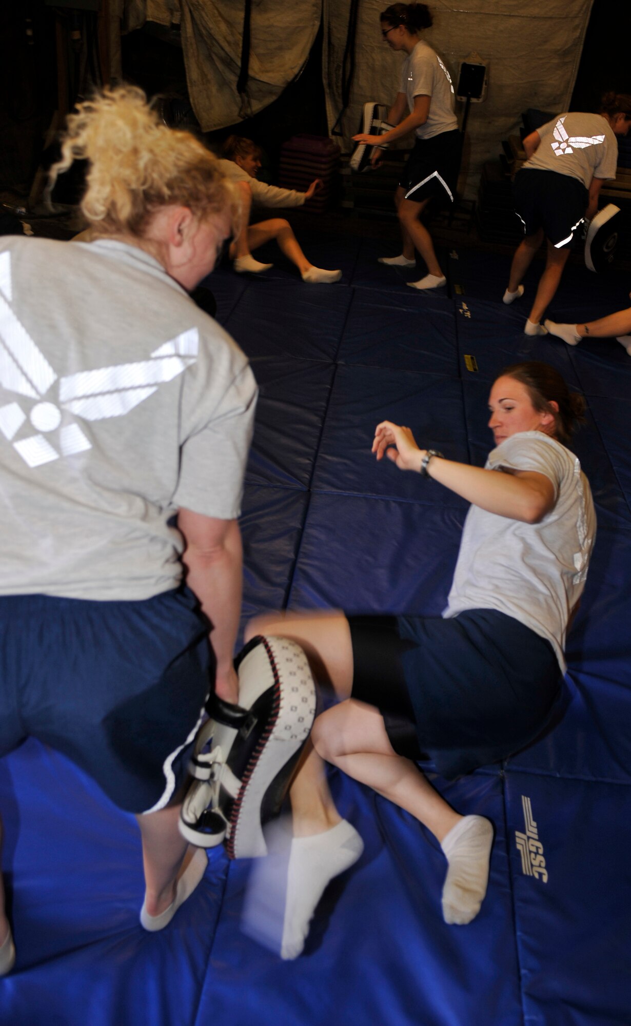 Capt. Emily Meredith lashes out at another student during a self-defense class at Bagram Airfield, Afghanistan, April 11, 2012. Meredith is the sexual assault response coordinator with the 455th Air Expeditionary Wing. The class was held in honor of Sexual Assault Awareness Month and taught easy-to-complete moves that could give a victim the advantage against a stronger opponent. (U.S. Air Force photo/Airman 1st Class Ericka Engblom)