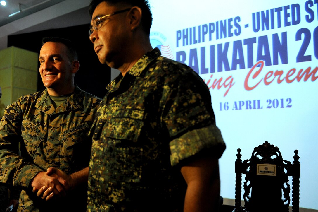 Brig. Gen. Frederick M. Padilla, Balikatan 2012 exercise director for U.S. forces, and Philippine Navy Rear Adm. Victor Emmanuel C. Martir, Philippine exercise director, stand shoulder to shoulder, displaying the partnership of their respective countries April 16 at Camp Aguinaldo, Philippines. Balikatan 2012 is the twenty-eighth iteration of the annual exercise and the third humanitarian assistance/disaster response focused exercise for the Philippines and the U.S. Padilla is the 3rd Marine Division commanding general, Okinawa, Japan.