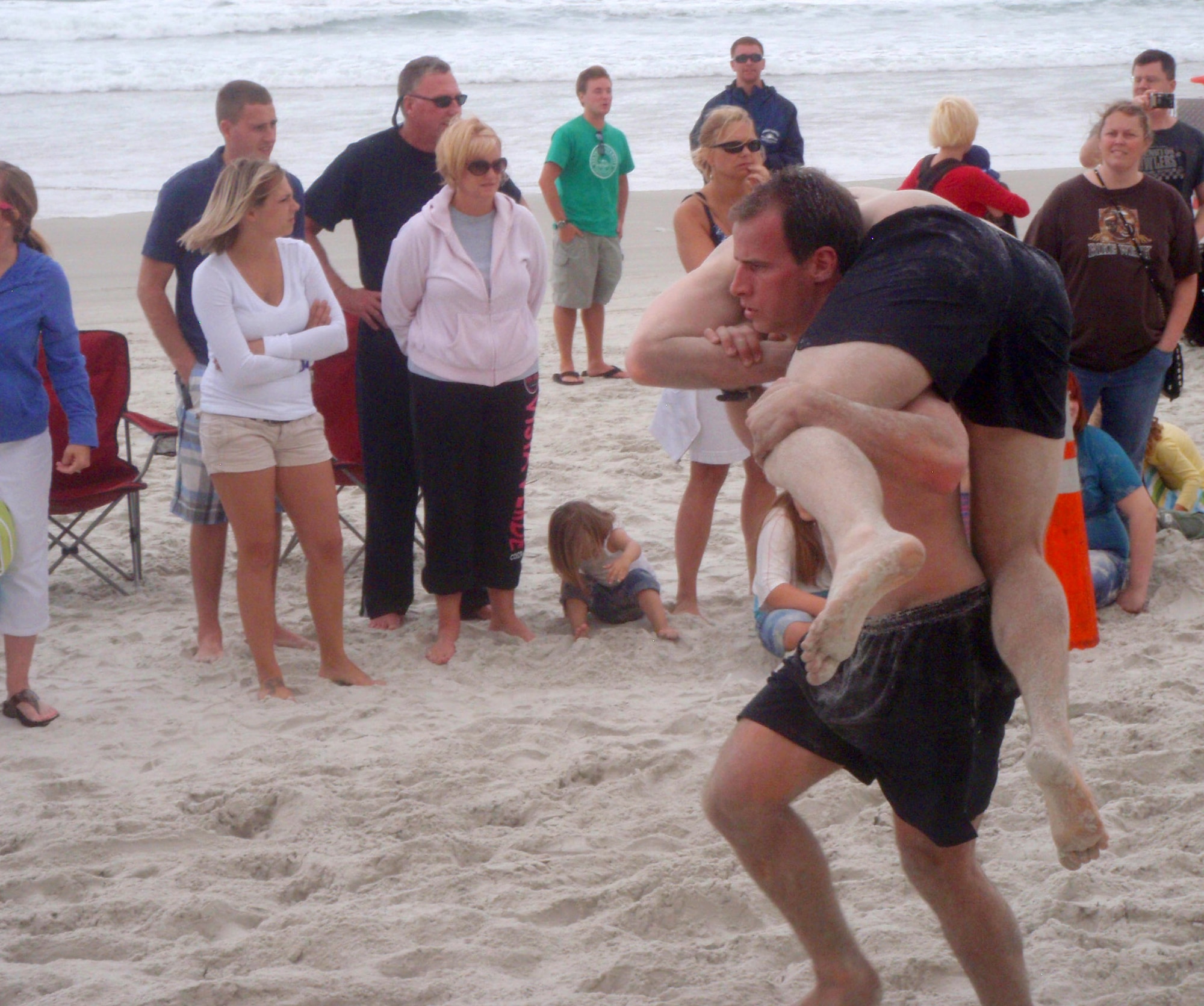 Pararescue Airmen from the 920th Rescue Wing, Patrick Air Force Base, Fla., participated in a difficult physical challenge called Battle of the Beach in Daytona Beach, Fla., April 14. The buddy-carry relay was one of many that tested their physical strength and stamina. During it they had to race 25 meters in the soft sand while carrying their teammate. (U.S. Air Force photo/Tech. Sgt. Adrian Durham)