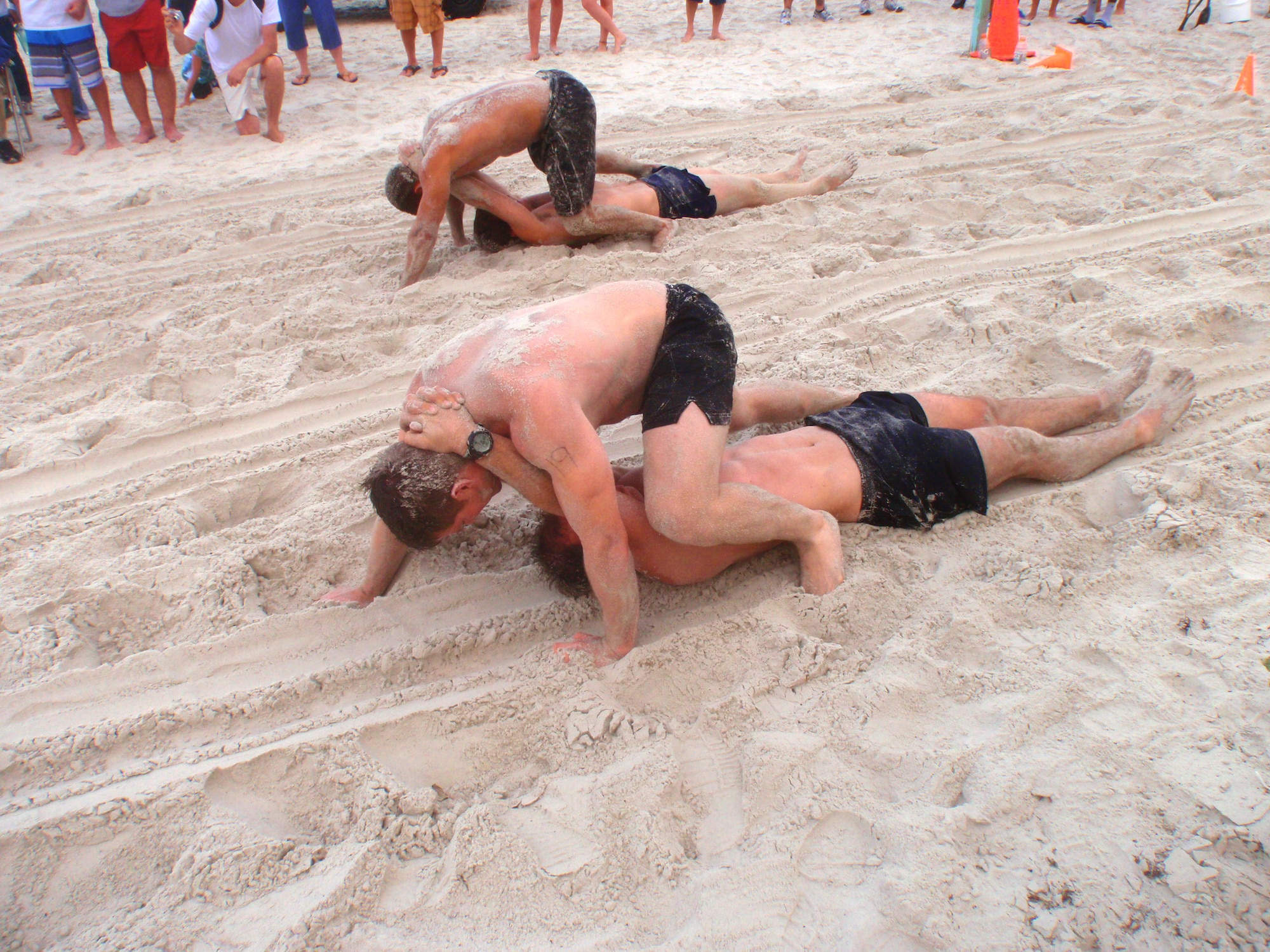 The bear-crawl buddy drag was one of the relays that pitted 30 teams of two against one another in the Battle of the Beach competition in Daytona Beach, Fla. April 14. Nine pararescue Airmen from the 920th Rescue Wing, Patrick Air Force Base, Fla., competed in the challenge as part of their ongoing physical training. The pararescue career field is one of the most physically and mentally demanding careers in the Air Force. (U.S. Air Force photo/Tech. Sgt. Adrian Durham)    