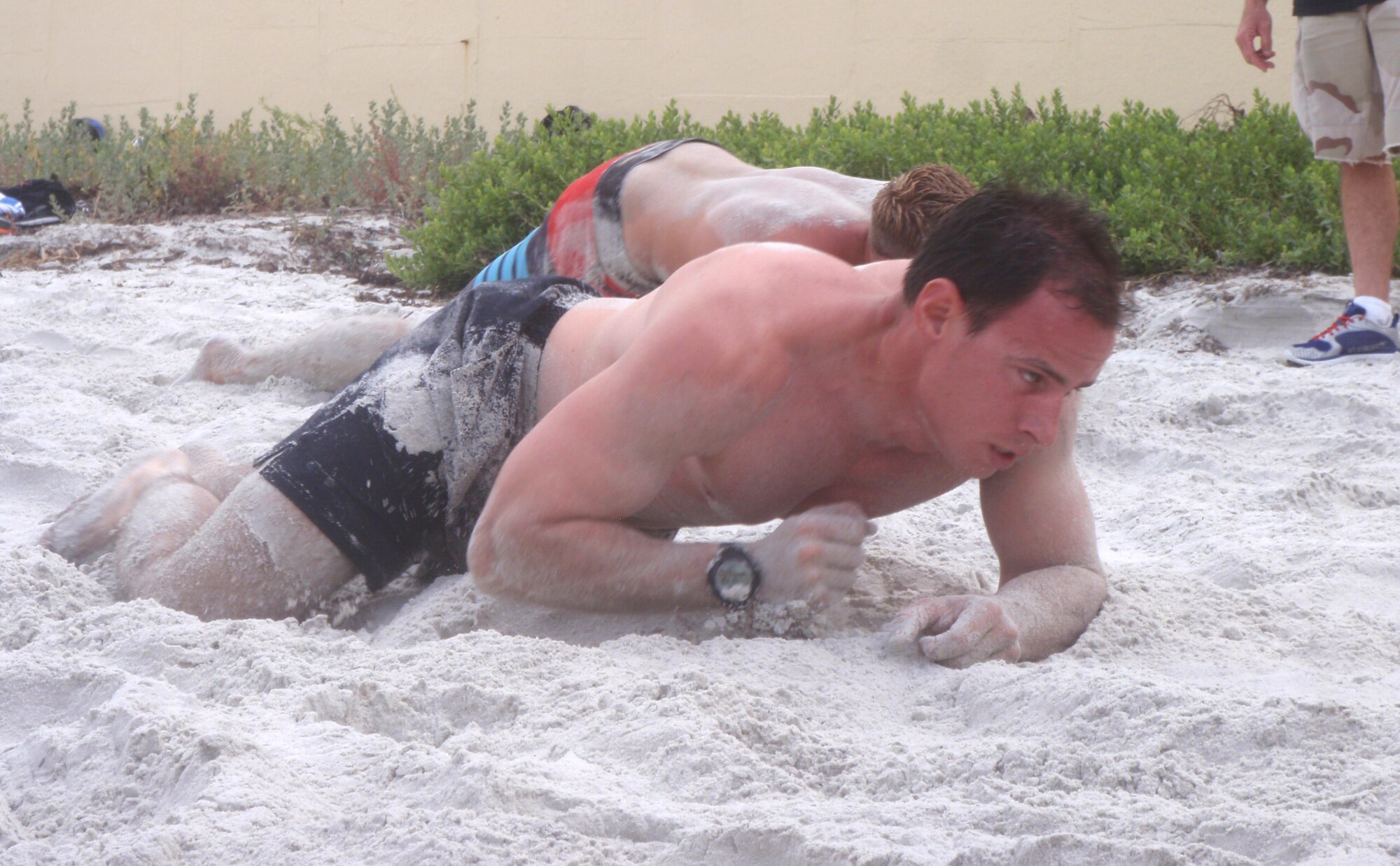 Air Force Reserve pararescueman Senior Airman James Kirsch, 920th Rescue Wing, Patrick Air Force Base, Fla., crawls through the sand during a physical challenge on the beach in Daytona Beach, Fla., April 14. Kirsch was one of 60 athletes and military personnel who entered the challenge as part of hisongoing training to meet the tough physical standards of being a pararescue Airmen trained to save lives on the battlefield. The Battle of the Beach competition started as an annual event six years ago. Nine Airmen from the 920th RQW participated. (Courtesy photo)