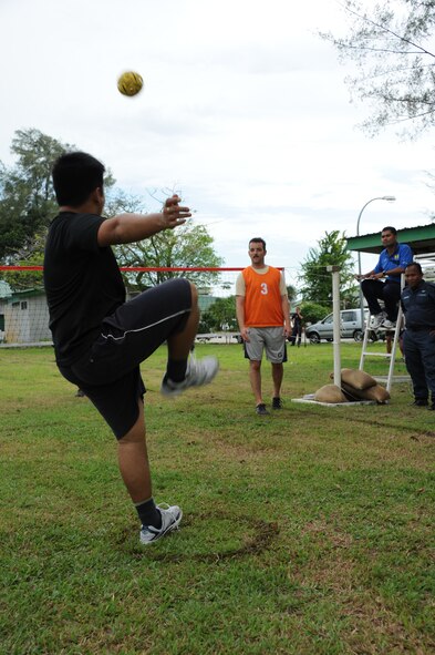 Royal Malaysian Air Force Capt. Firdaus Rosnam (left), No. 6 Squadron Hawk 208 pilot, serves the ball after receiving a toss from Capt. Brett Vanderpas, 67th Fighter Squadron F-15C pilot, during a sports evening during Cope Taufan 2012 at TUDM Butterworth April 12, 2012. U.S. and RMAF airmen competed in soccer, volleyball and sepak takraw, a traditional Malaysian sport, as part of a camaraderie and friendship building event. Sports have long played and important role in building esprit de corps and physical fitness in both countries militaries. Cope Taufan is a live-flying exercise designed around dissimilar basic fighter maneuvers and dissimilar air combat tactics training. (U.S. Air Force photo/Master Sgt. Matt Summers)