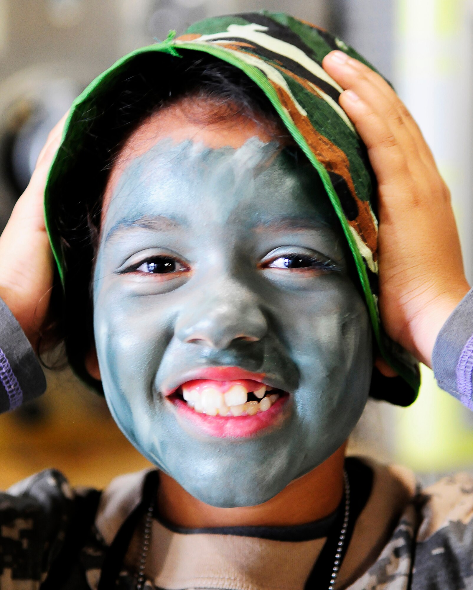 GOODFELLOW AIR FORCE BASE, Texas -- Elizabeth Tayeb, 7, daughter of Staff Sgt Zac Tayeb, 344th Military Intelligence Battalion, enjoys being "deployed" in support of Operation Kids April 14.  The mock deployment event gives military youths a glimpse of what their parents go through using a series of educational activities. (U.S.Air Force photo/Staff Sgt. Austin Knox)
