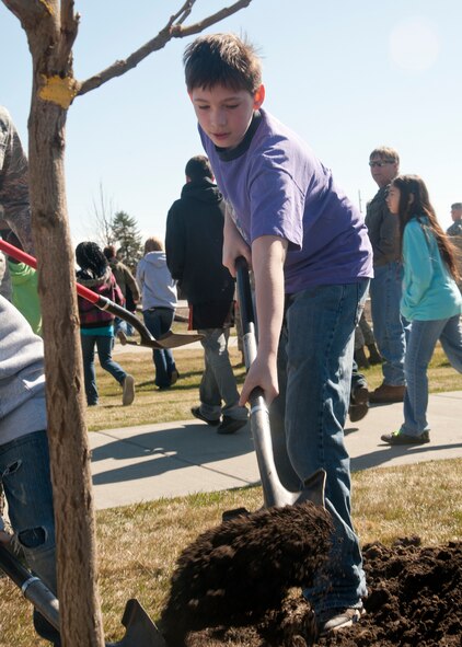 Zachary Gregoire, Michael Anderson Elementary School student, helps plant a tree during the Arbor Day celebration at Fairchild Air Force Base, Wash., April 13, 2012. This year marks the base’s 18th year of participation in Arbor Day. (U.S. Air Force photo by Staff Sgt. Michael Means/Released)