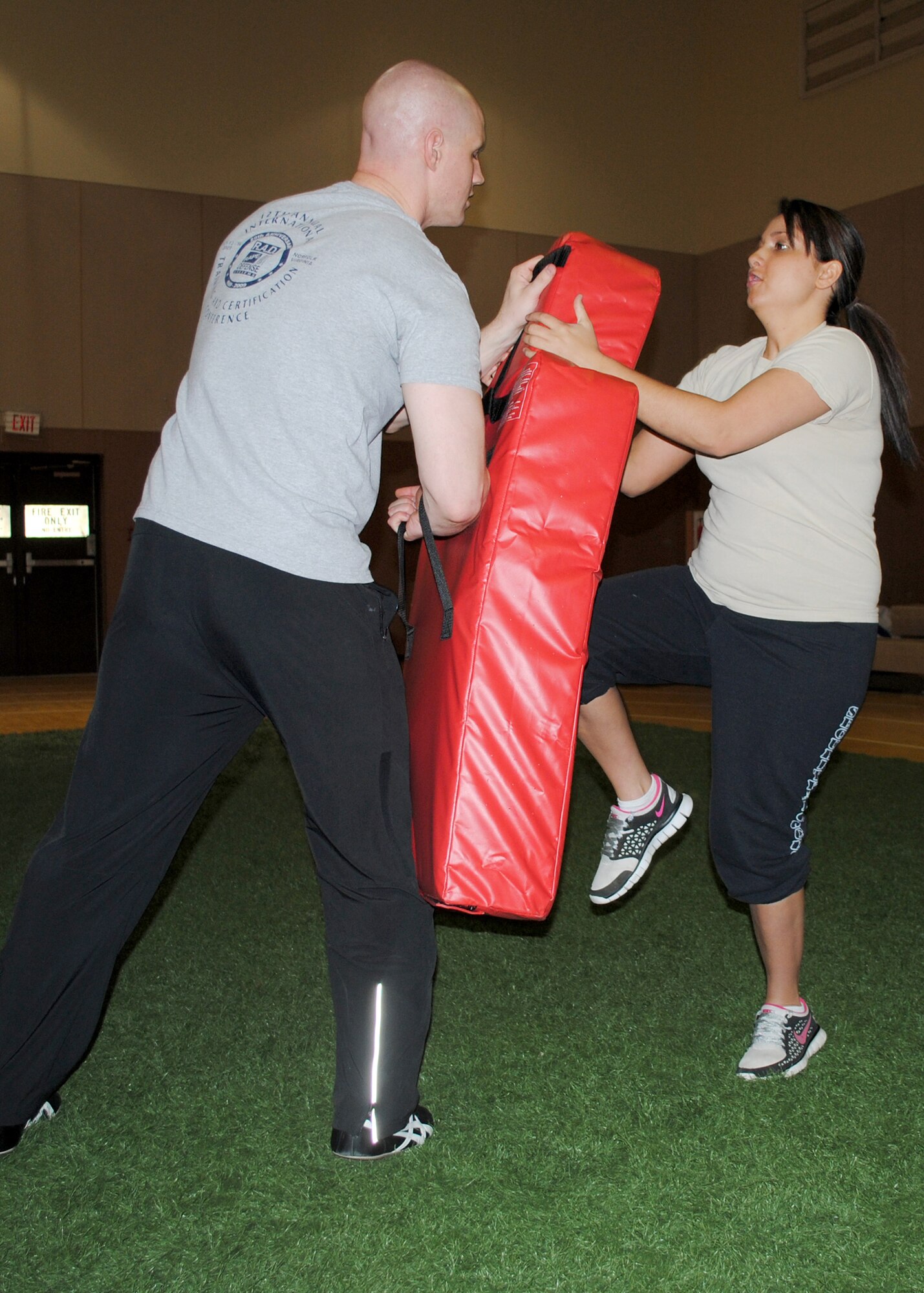 Capt. Michael Cheatham, 741st Missile Security Forces Squadron operations officer, teaches Airman 1st Class Julia Salsgiver, 741st MSFS mobile fire team member, a defensive move during a Rape Aggression Defense class at the Fitness CEnter April 6. (U.S. Air Force photo/Airman 1st Class Katrina Heikkinen)